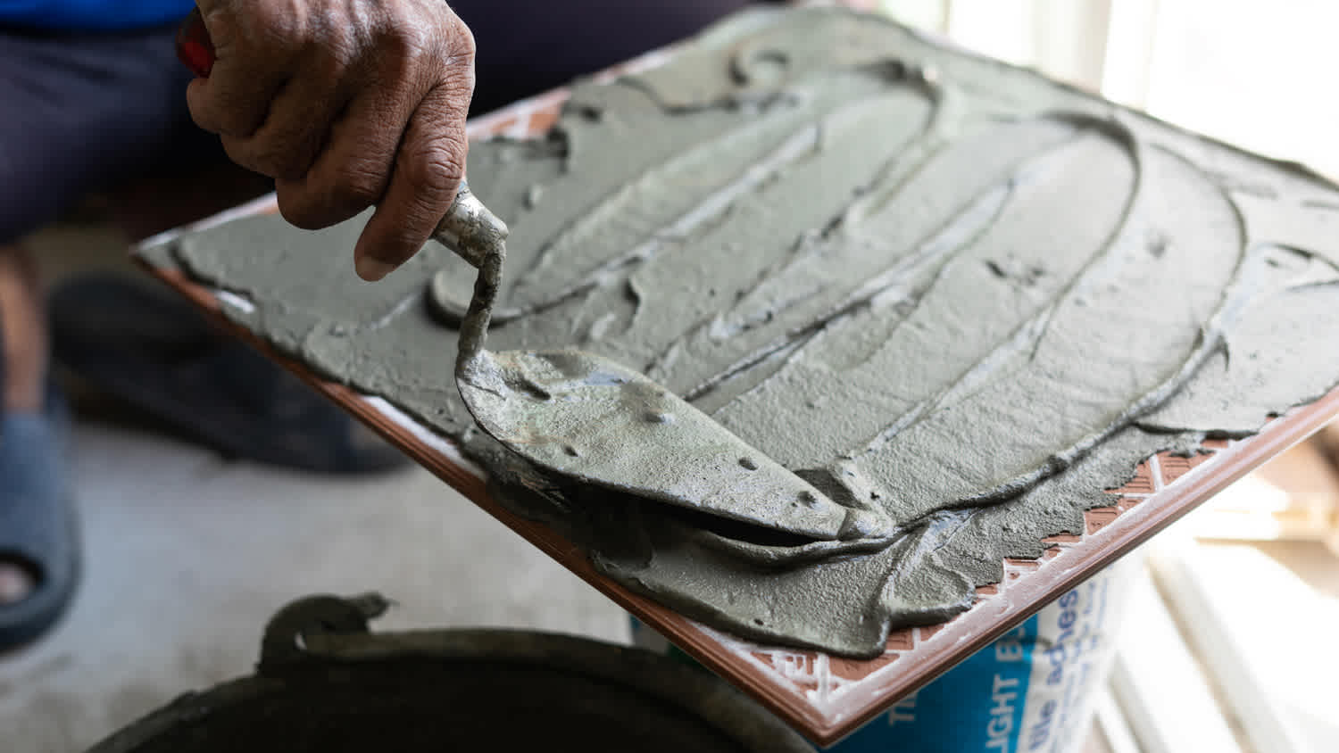 Tile with trowel and plaster