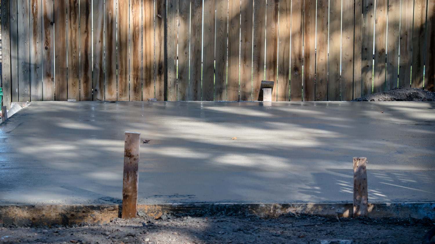 Wet cement foundation in wooden frame