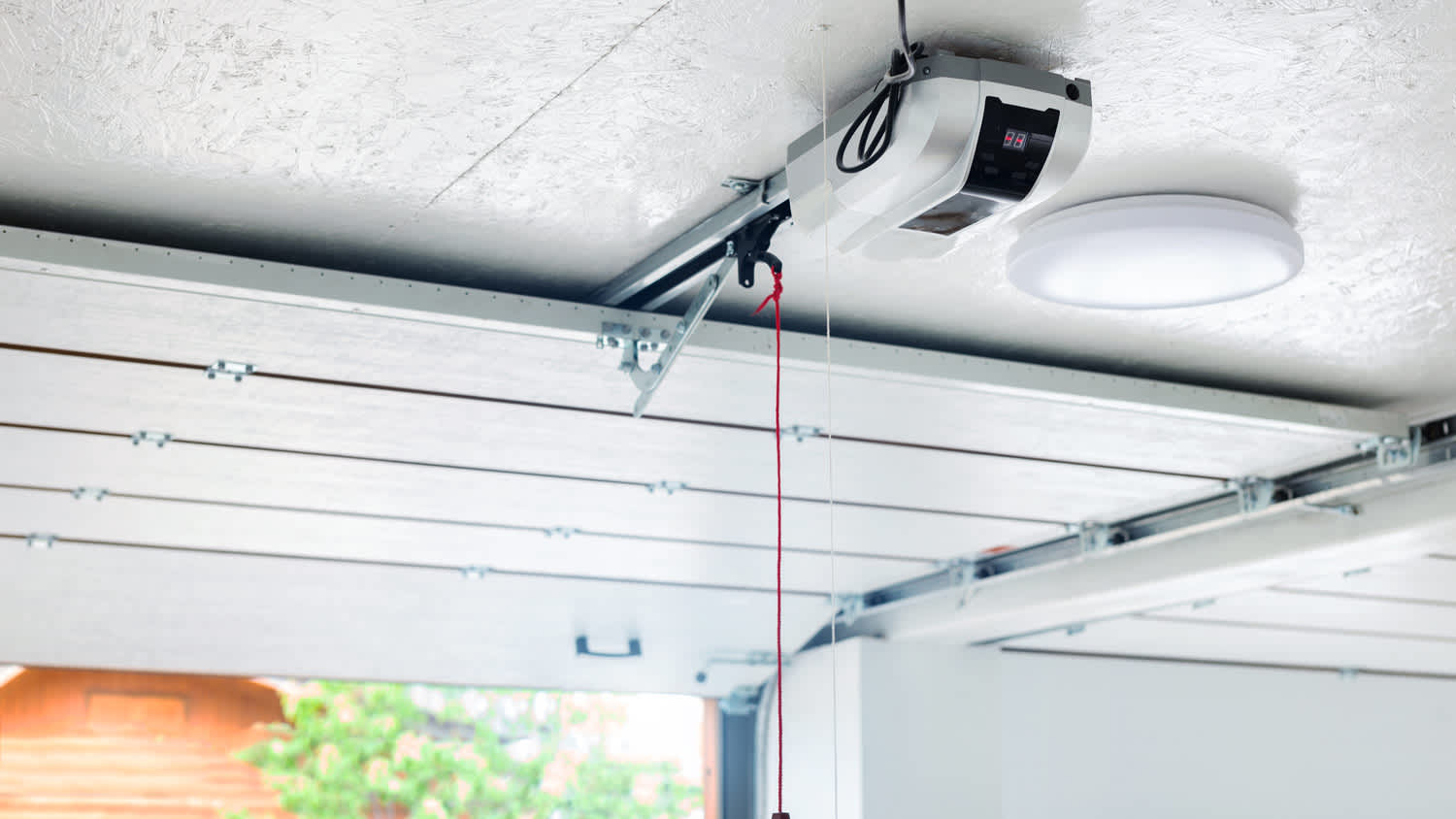 Opening garage door with sensor