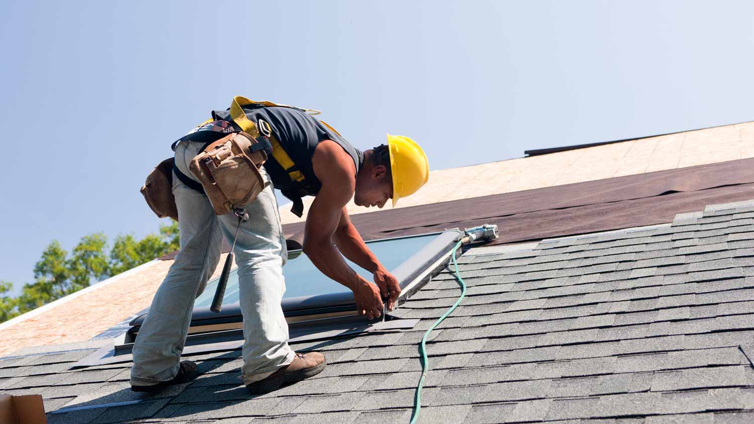 A professional installing a new skylight