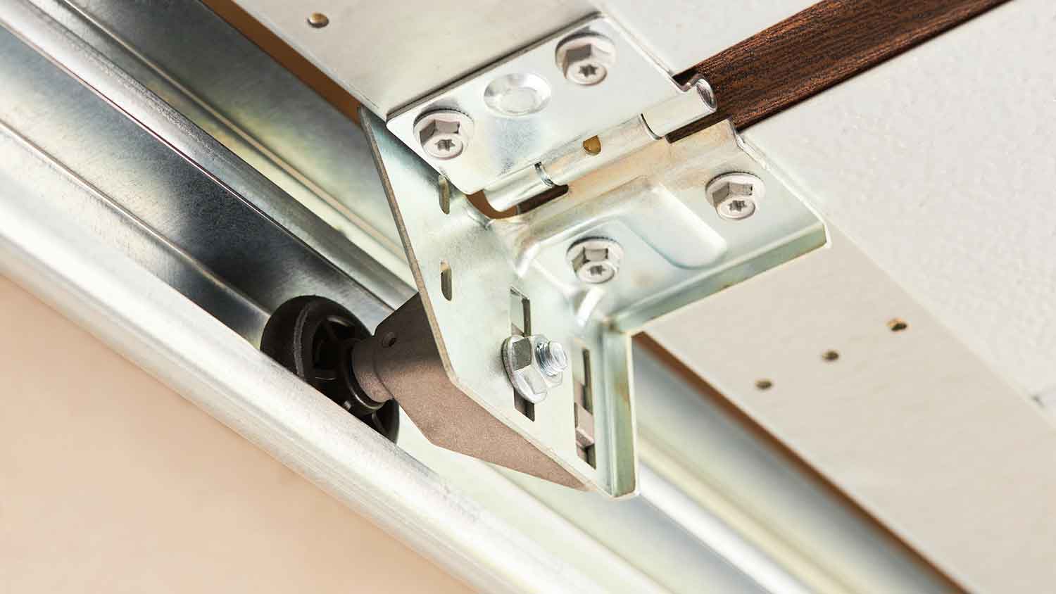 Closeup of an automatic garage door roller on a new track