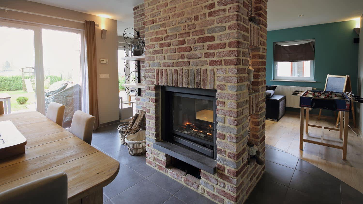 Traditional fireplace with brick wall