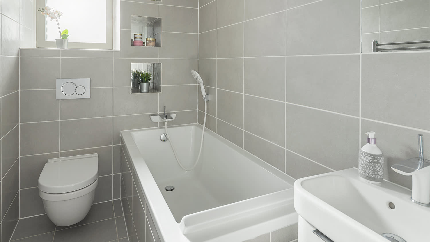 Bathroom with gray tile and white grout