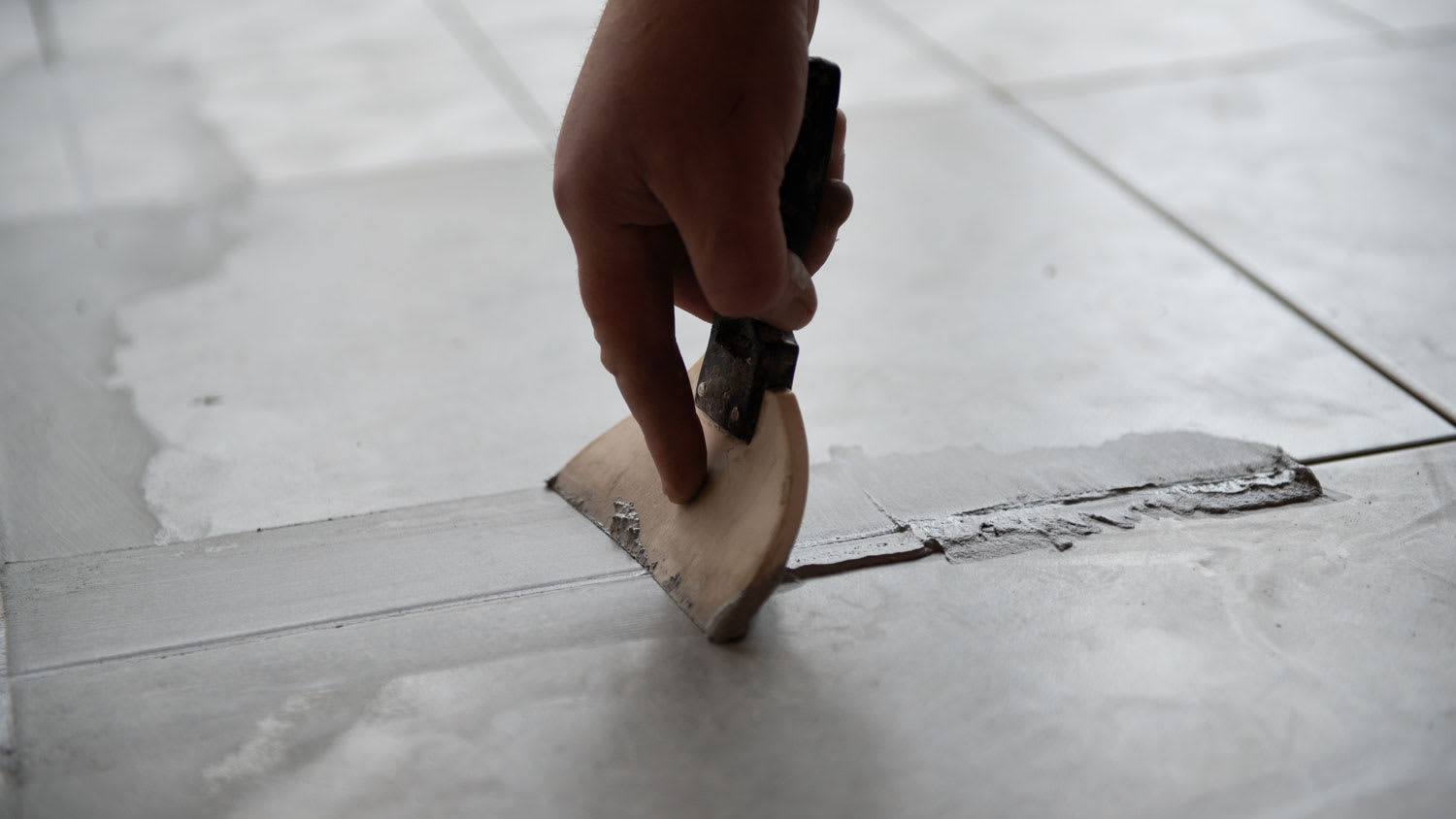 Cement grout on floor tiles