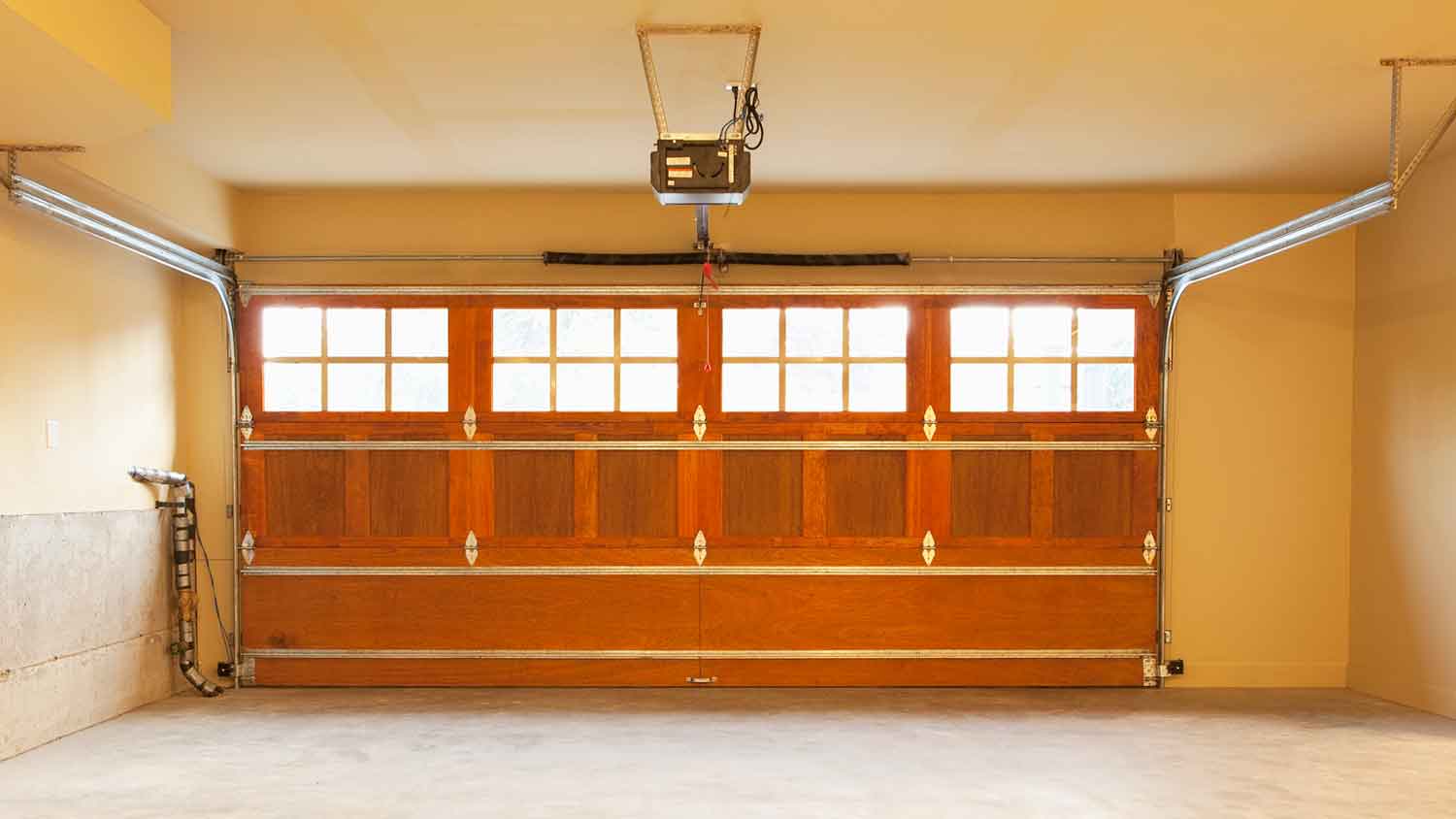Empty home garage interior with closed doors