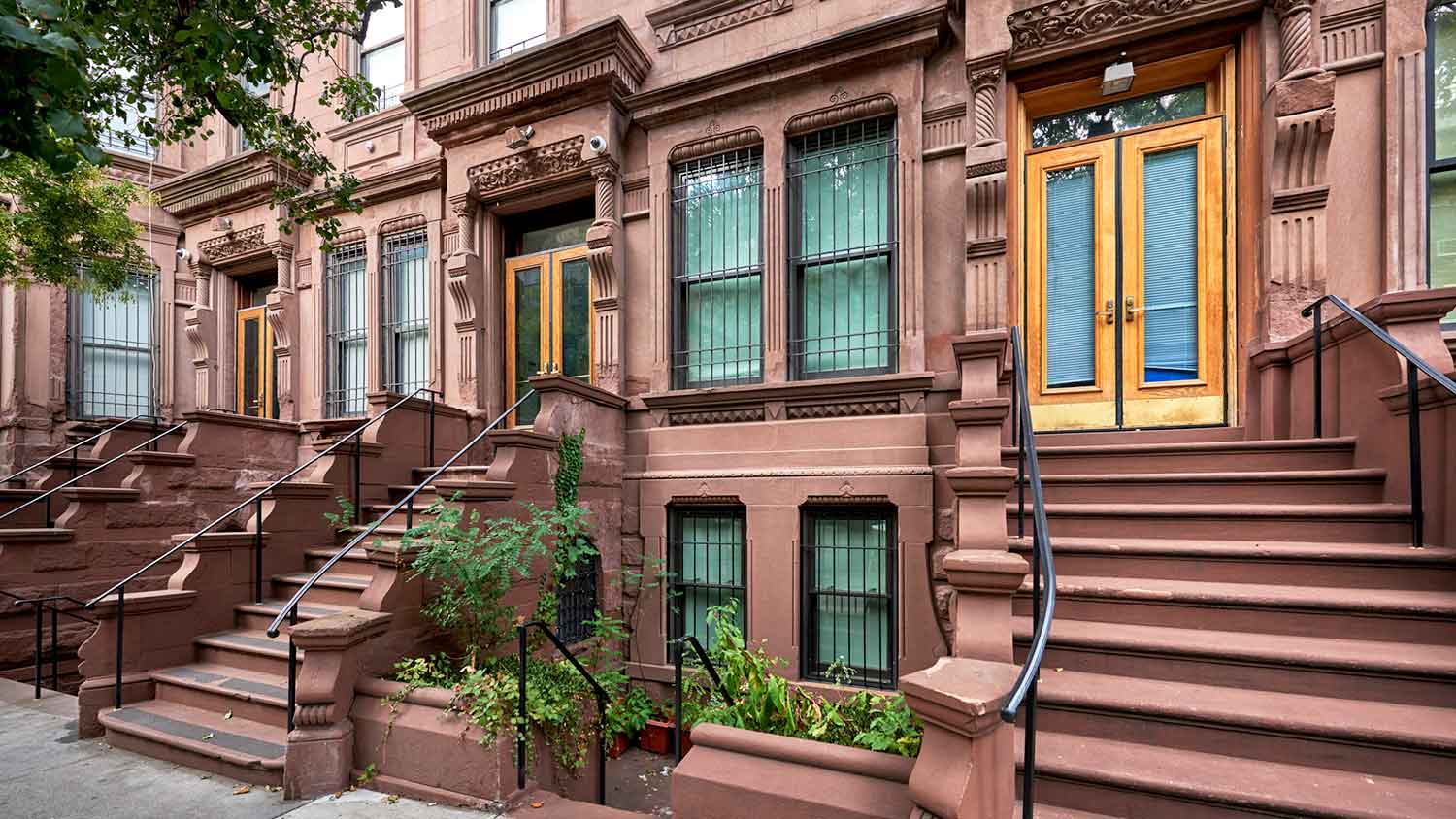 Staircases leading up to a brownstone building