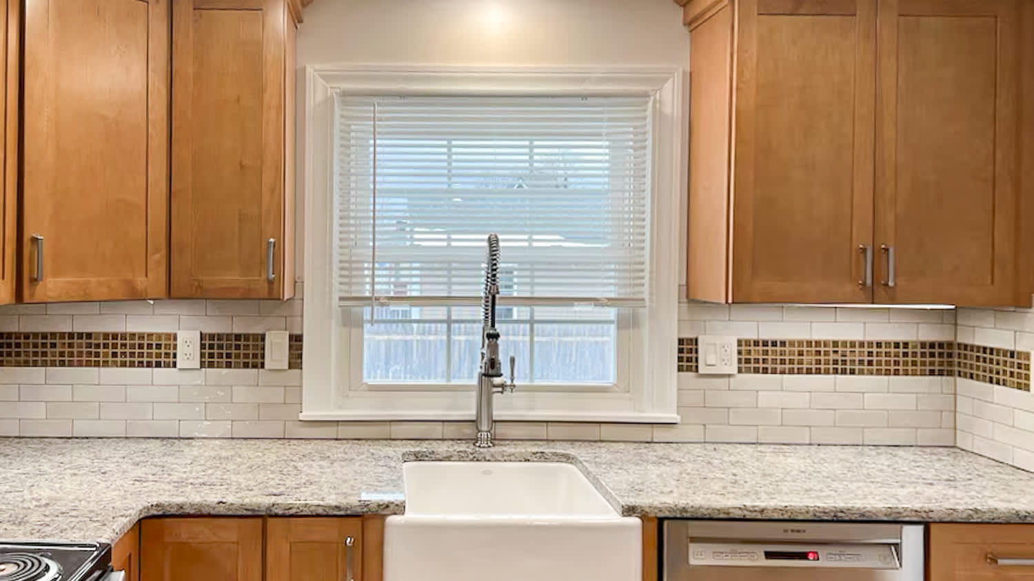 Wooden kitchen with marble countertop