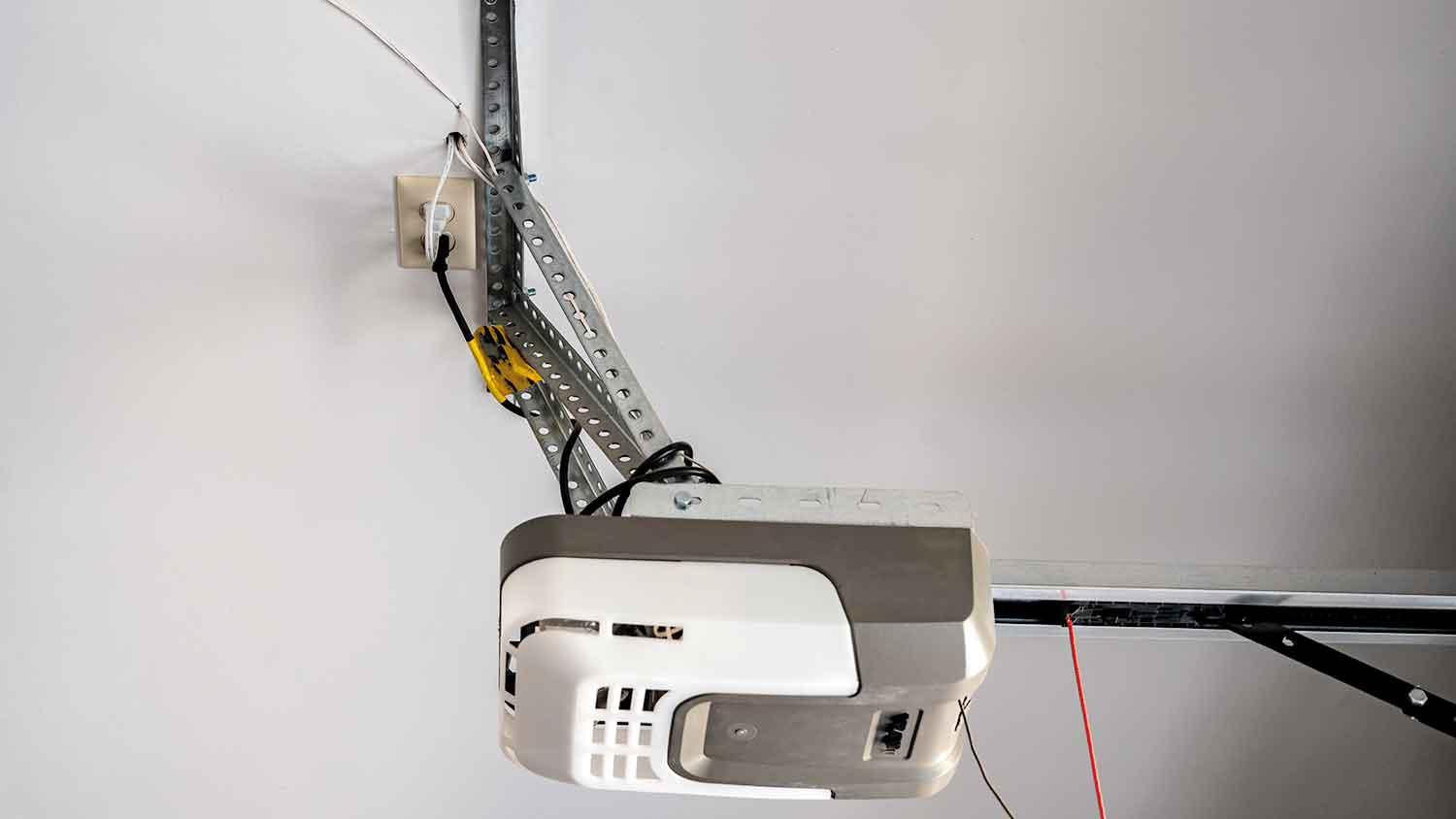 Automatic garage door opener plugged to power supply