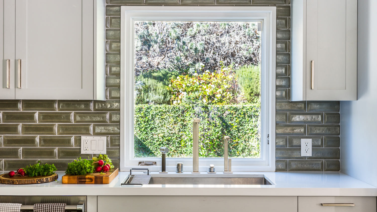 Kitchen sink with tile background