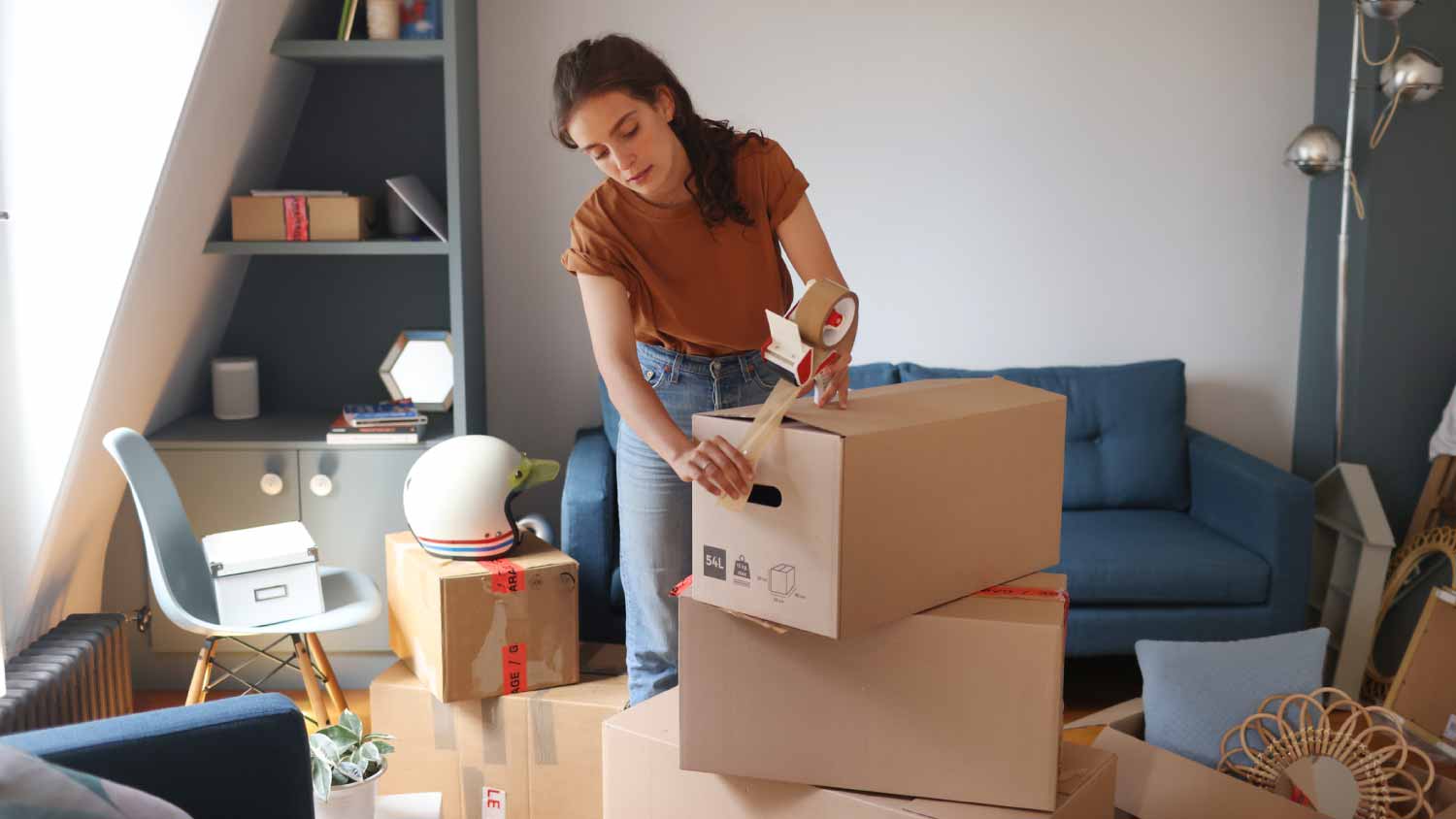Woman packing boxes