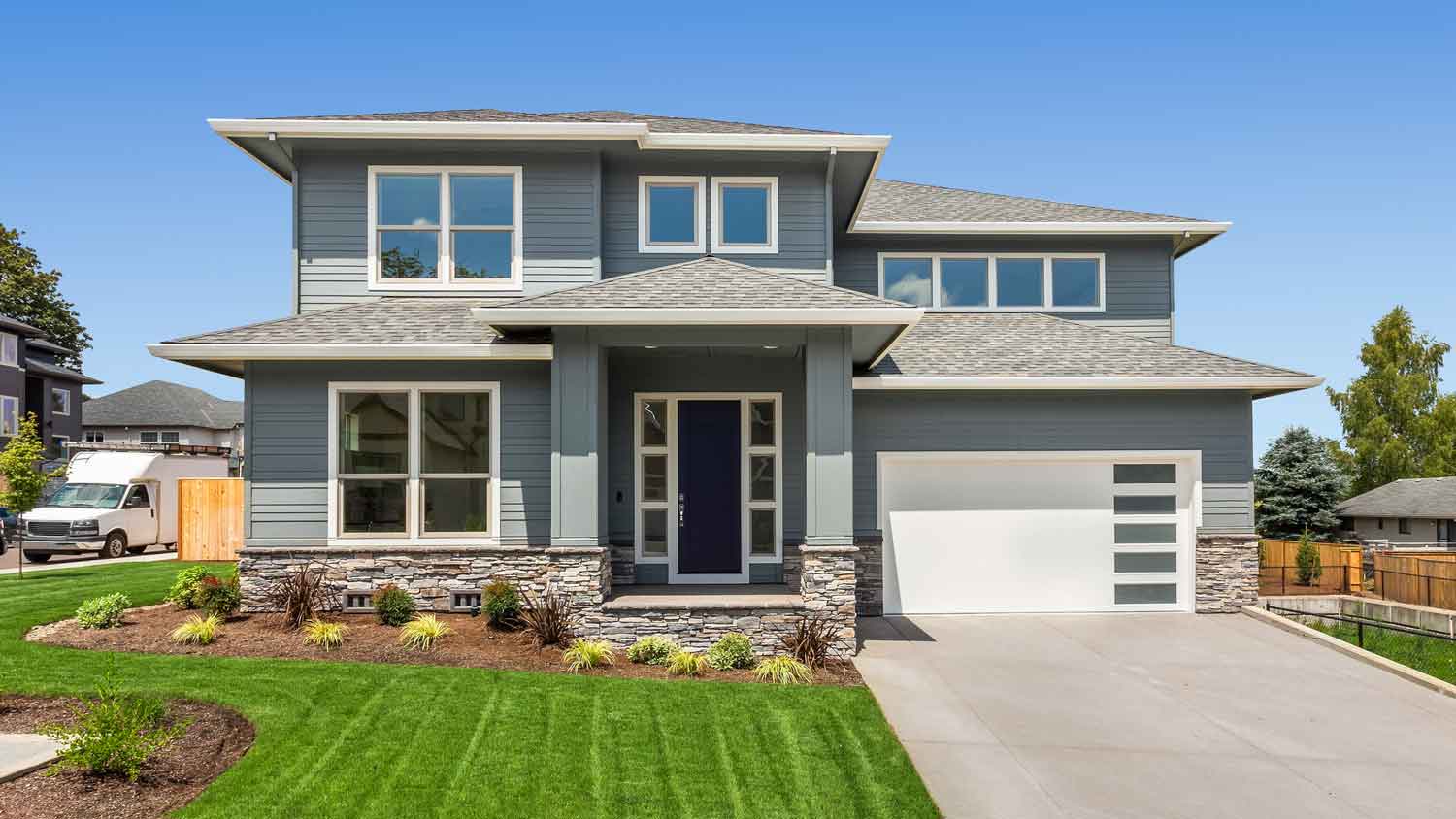 The exterior of a stone veneer house
