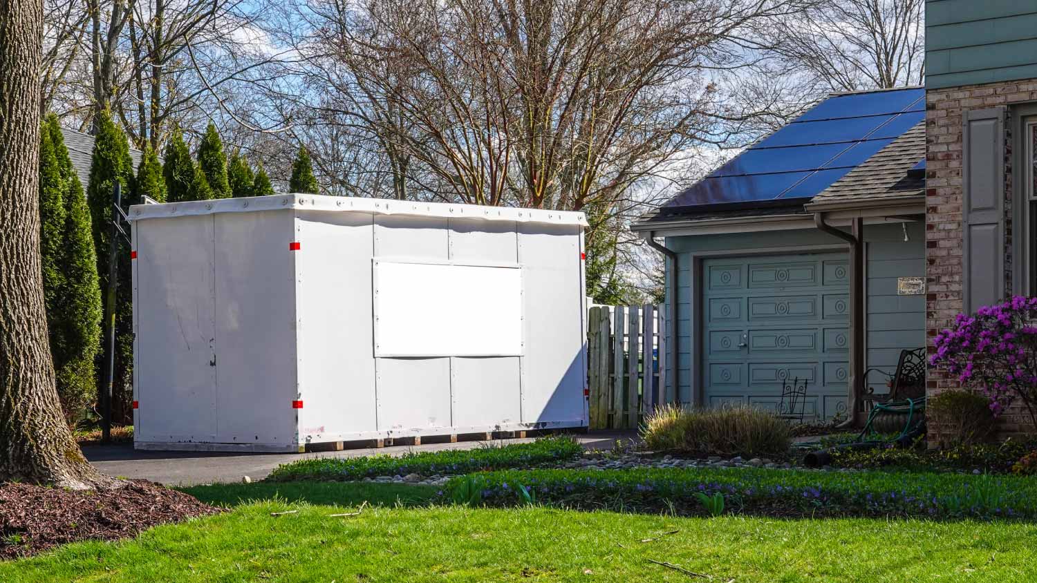 White storage pod unit in the driveway
