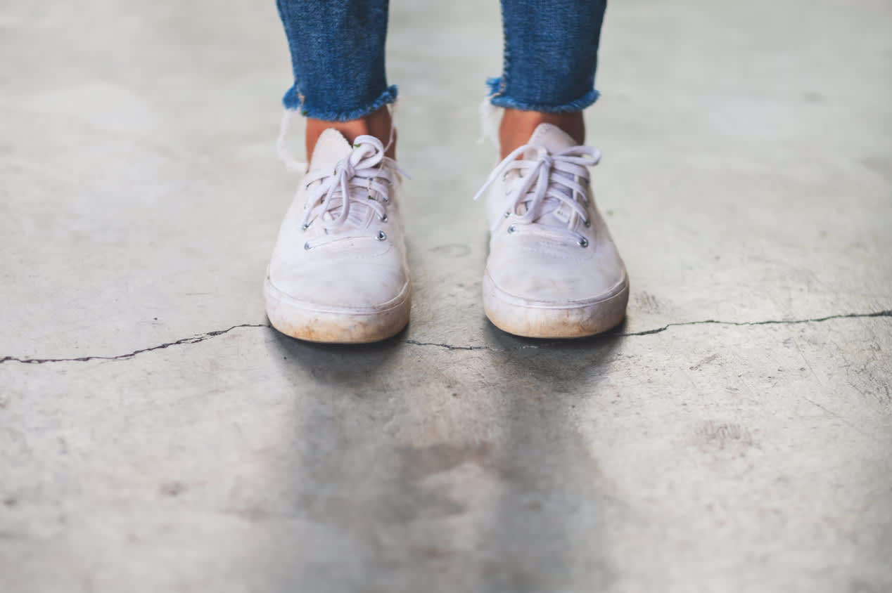 Woman standing on a cracked floor