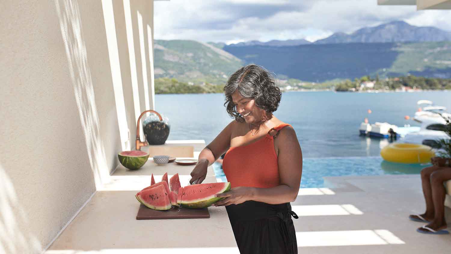 Smiling woman in her tropical home