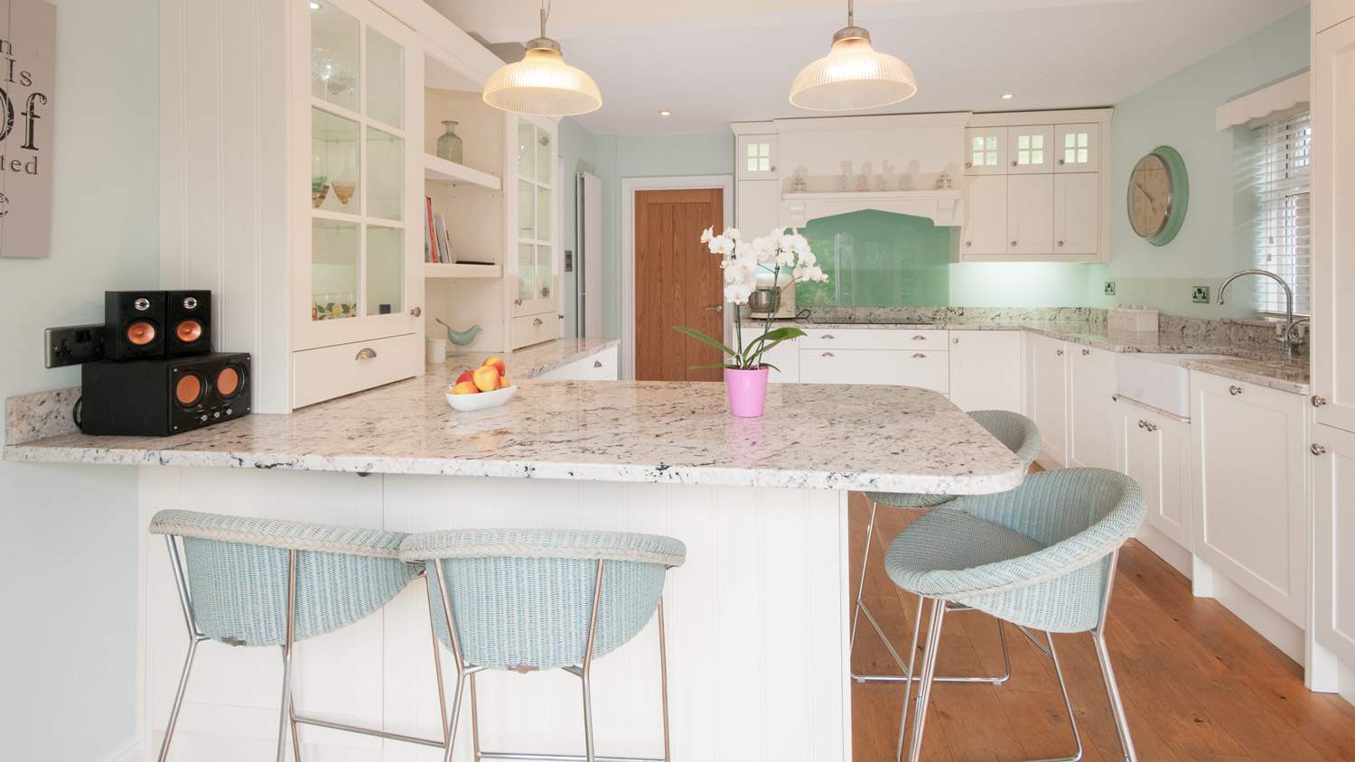 Kitchen with white countertop and chairs