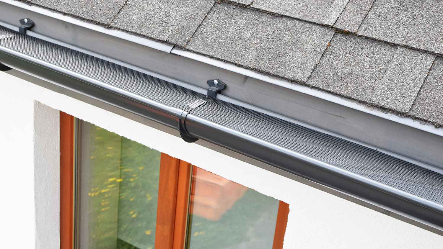 Mesh gutter guard installed on the house gutter