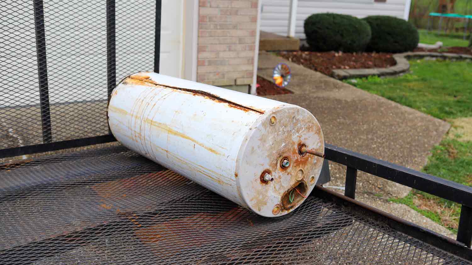 old water heater outside of home