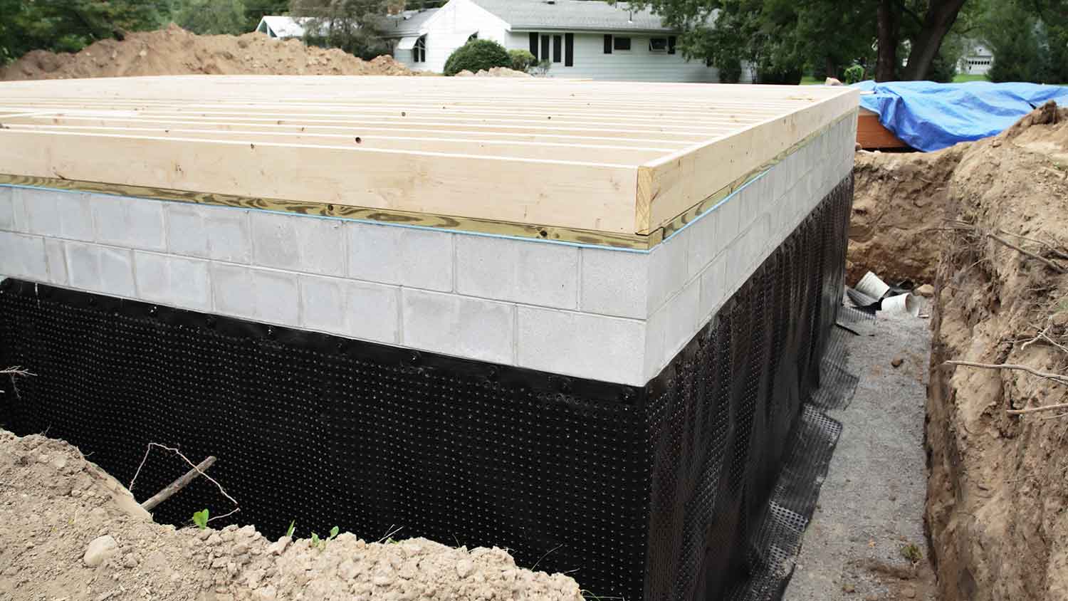 Waterproofing membrane applied to the exterior of the foundation