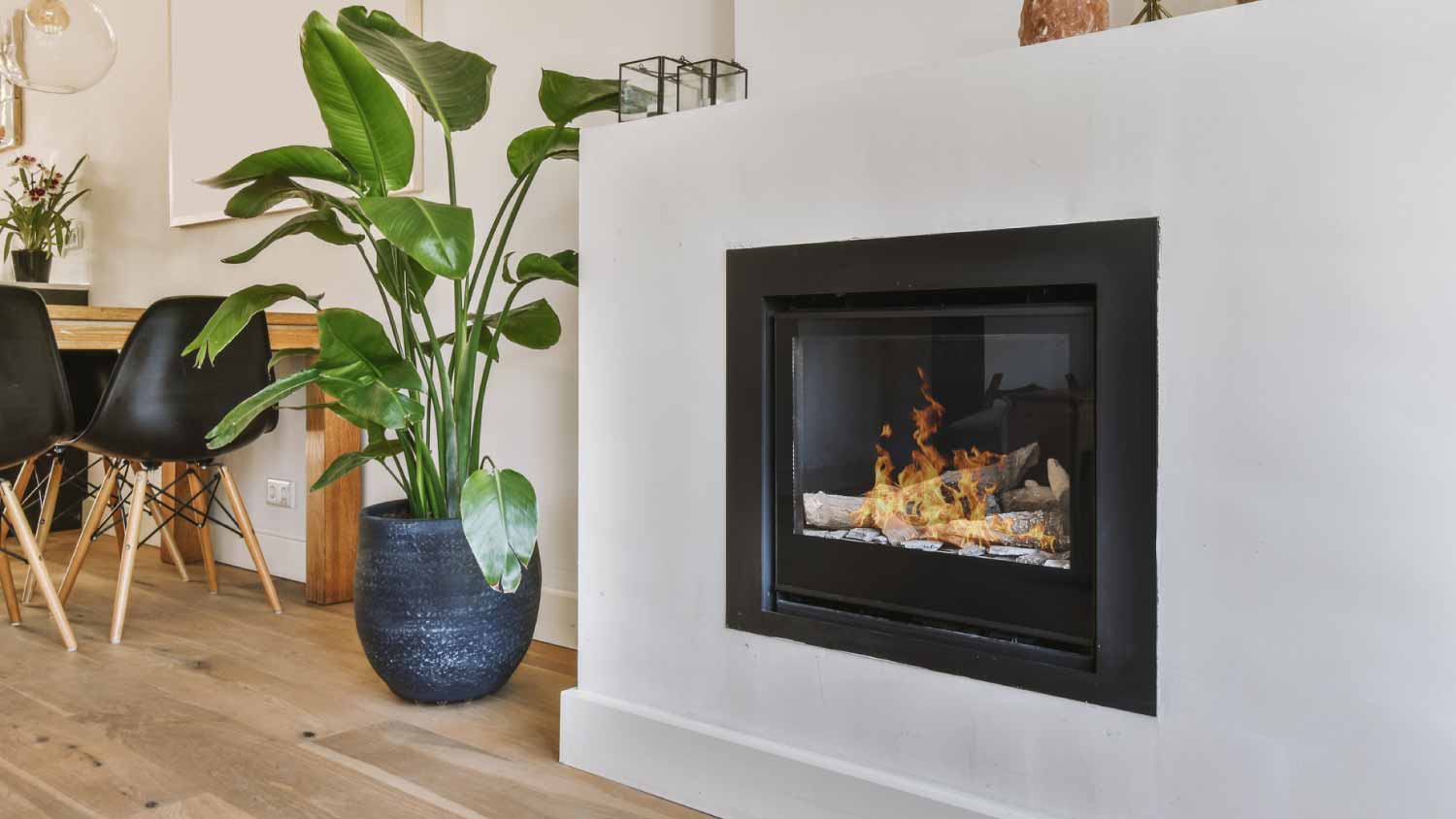 Modern fireplace in white wall