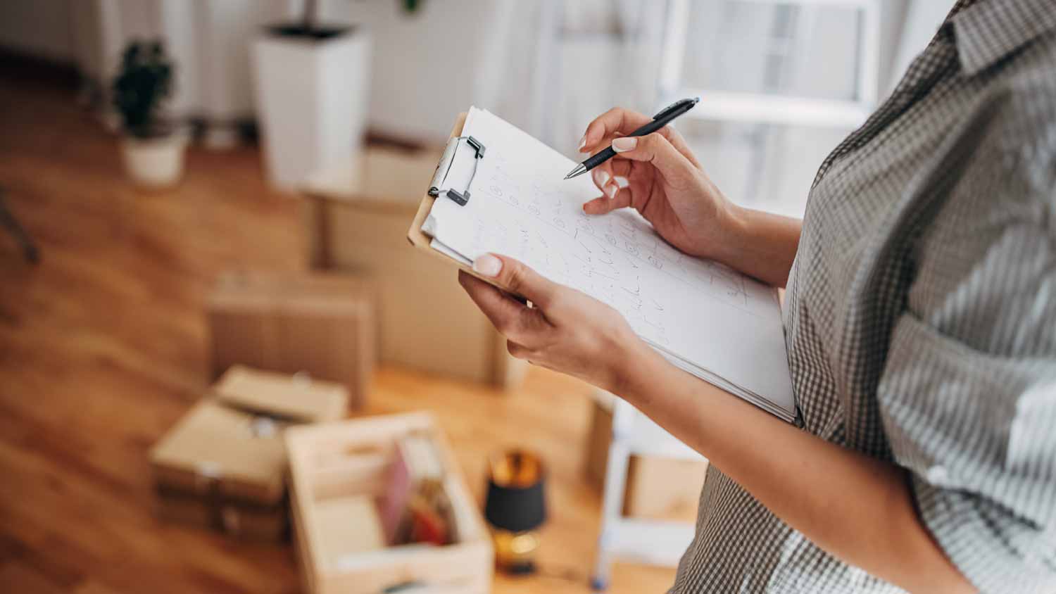 Woman writing in checklist