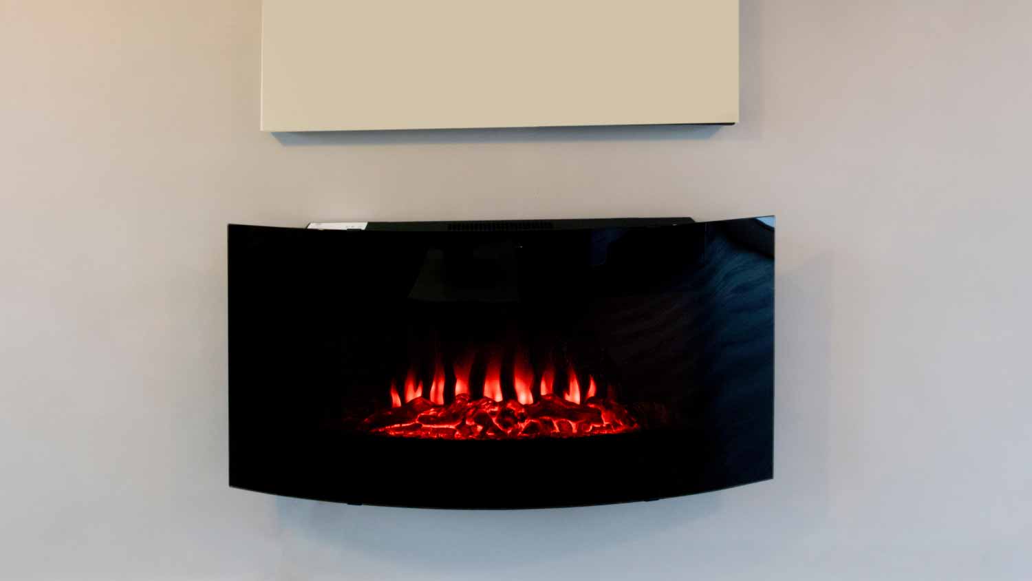 A electric fireplace in white wall