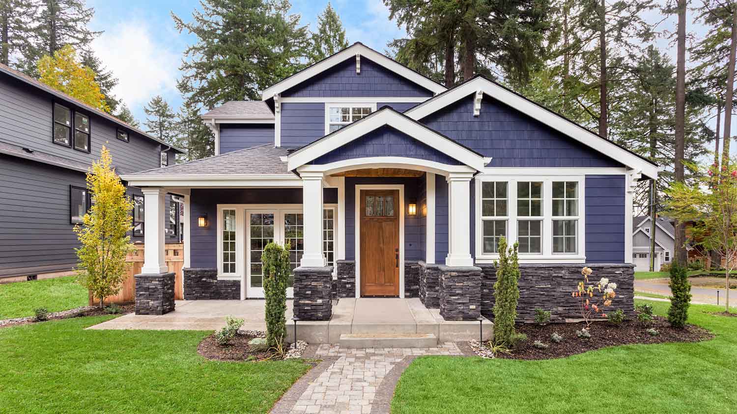 Navy blue house exterior in the neighborhood