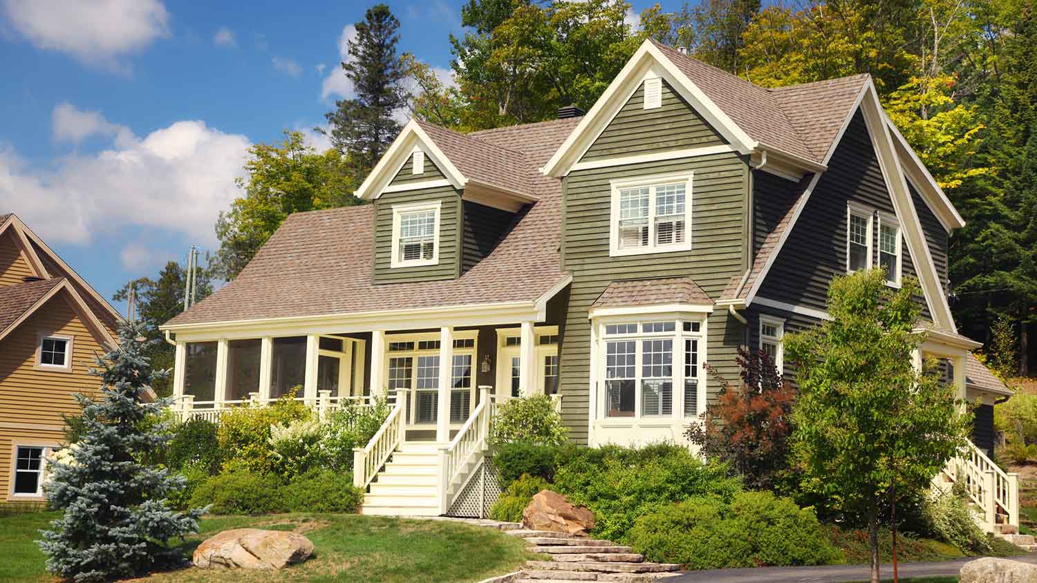 Two-story olive-green house exterior