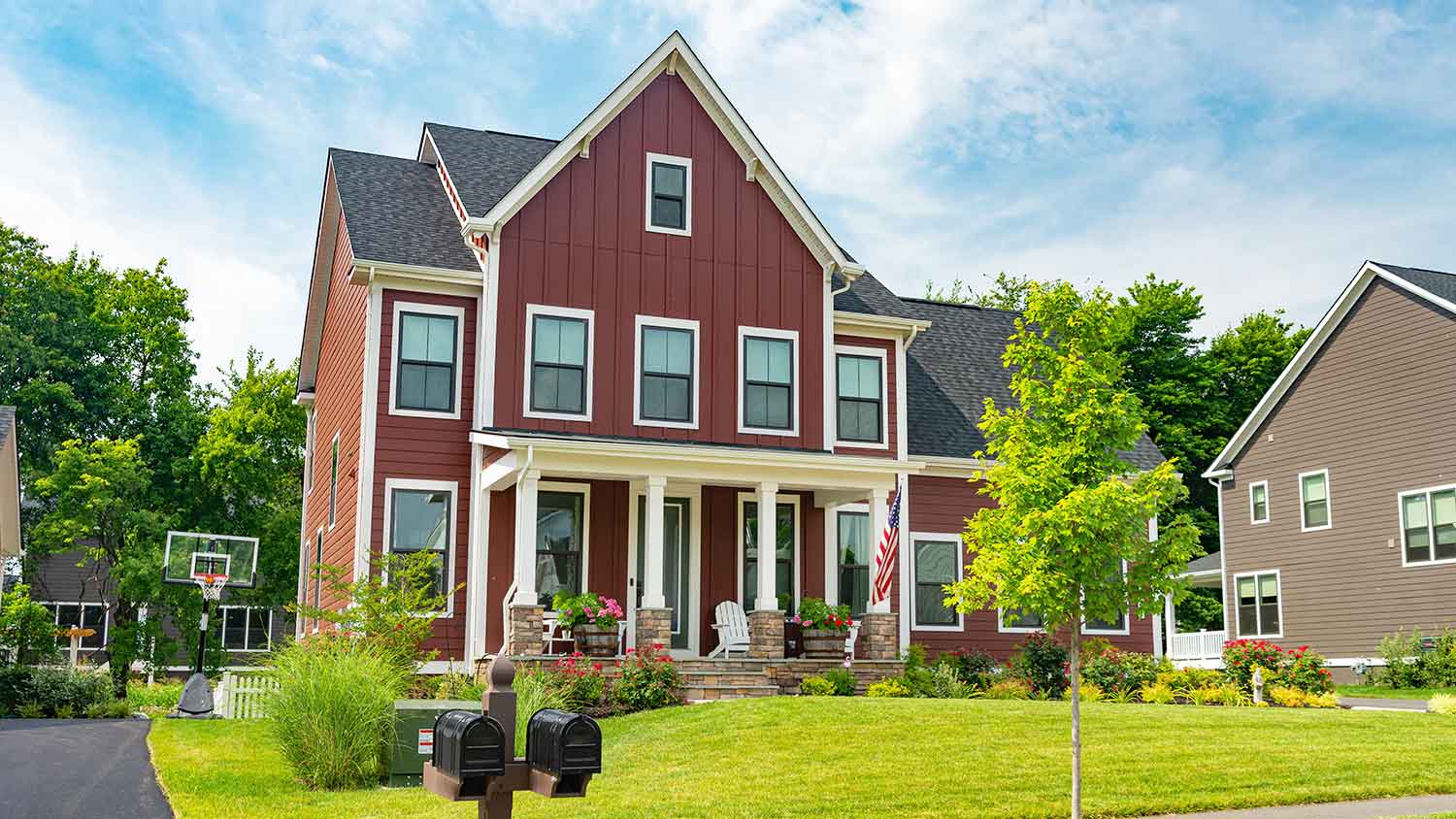 Modern home with burgundy metal siding