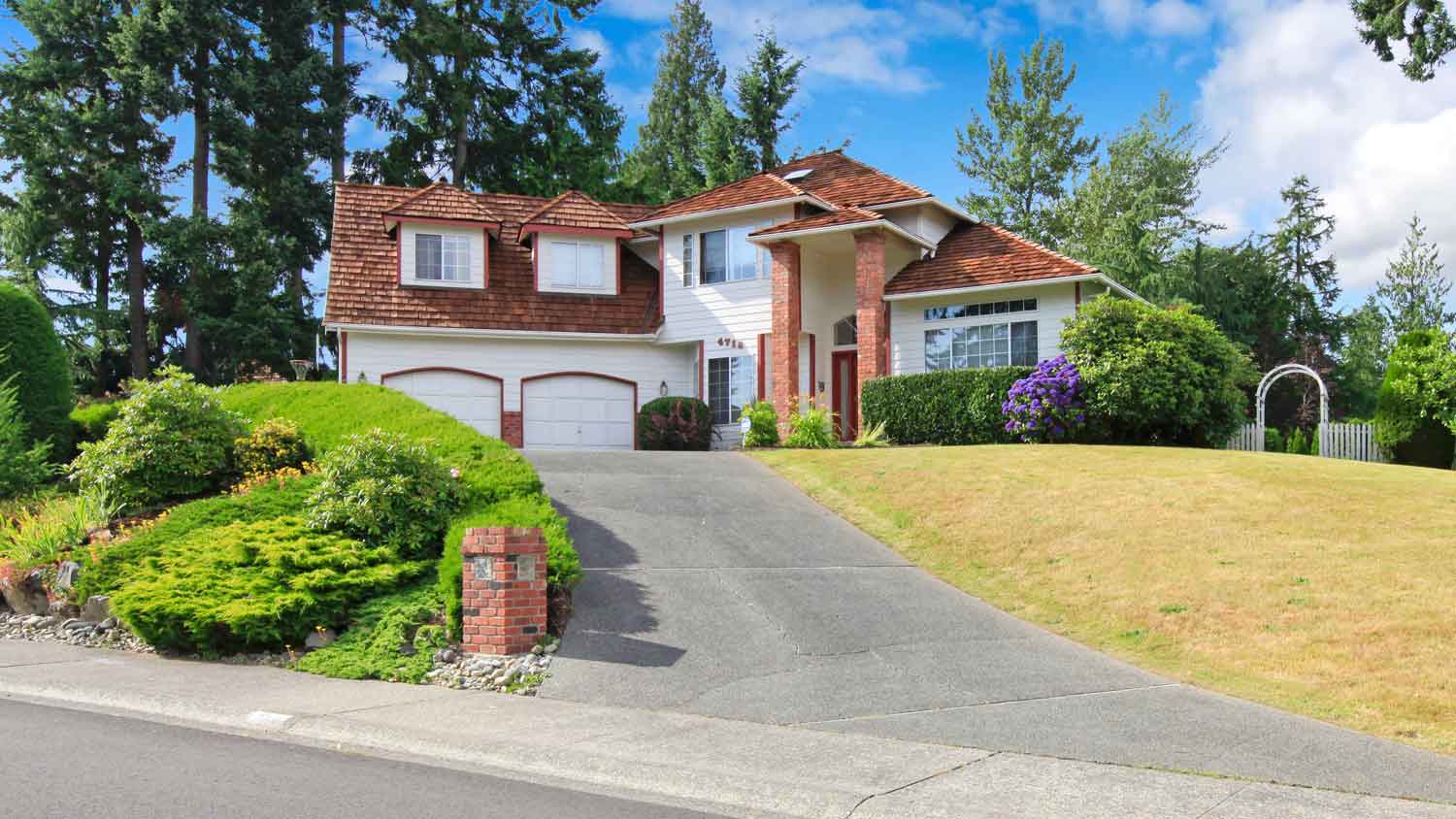 A house on a hill with a gentle driveway slope