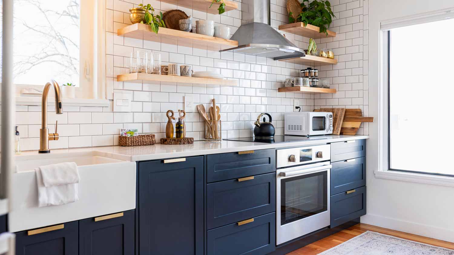 An one-wall kitchen with blue cabinets