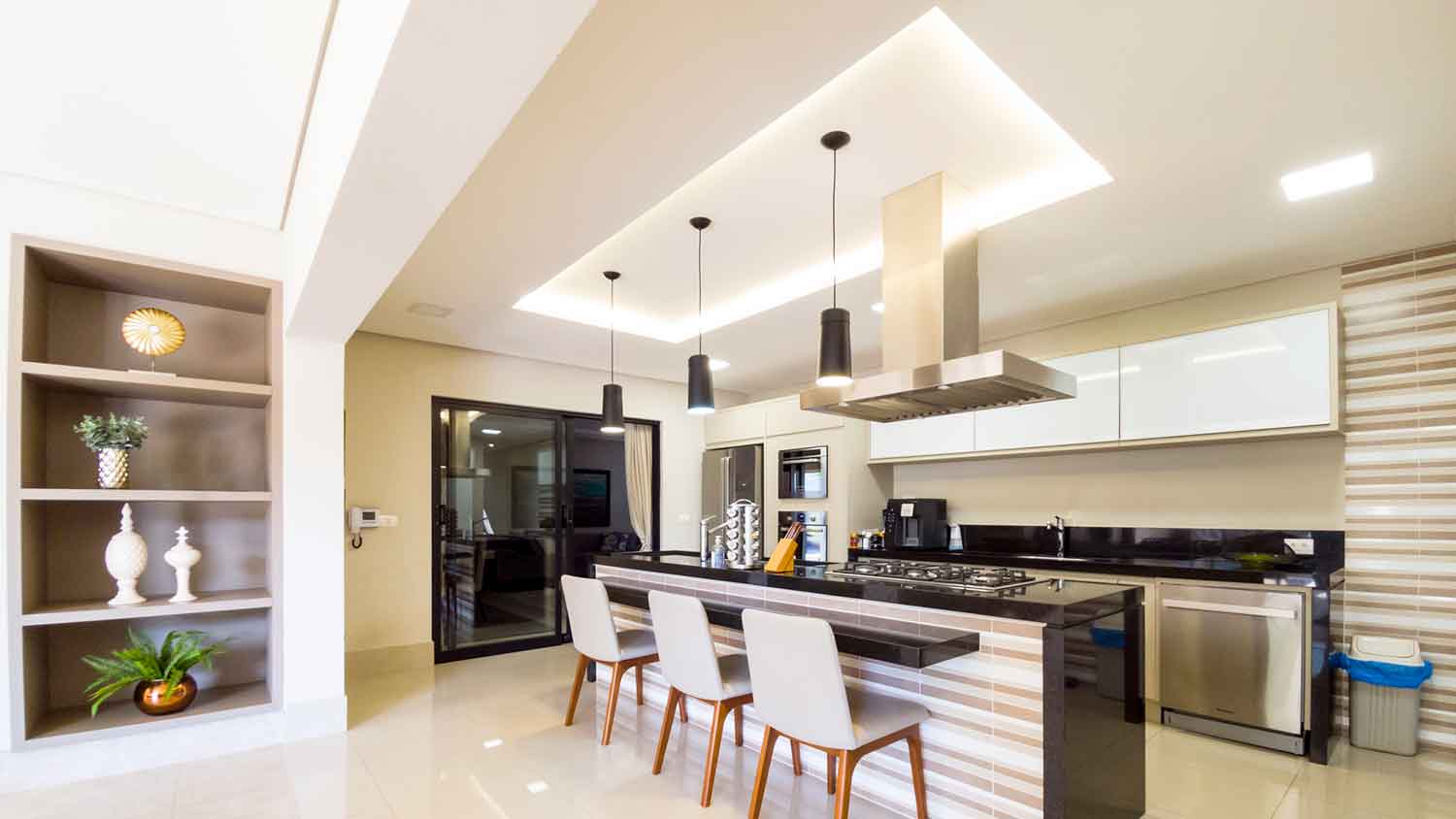 Modern kitchen with tray ceiling lighting