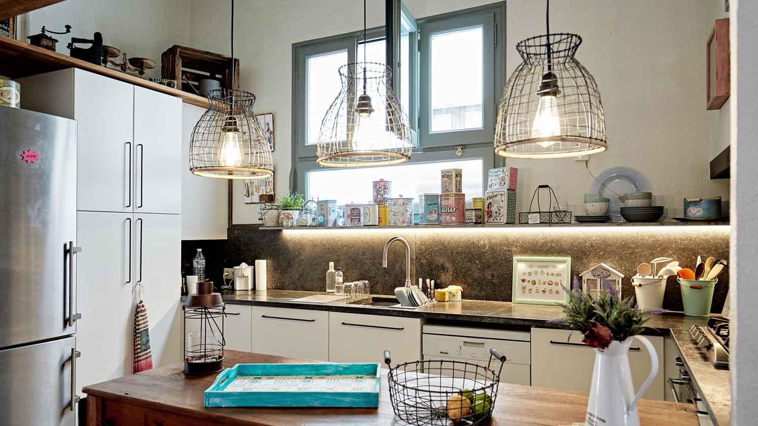 Rustic kitchen interior with industrial pendant lighting