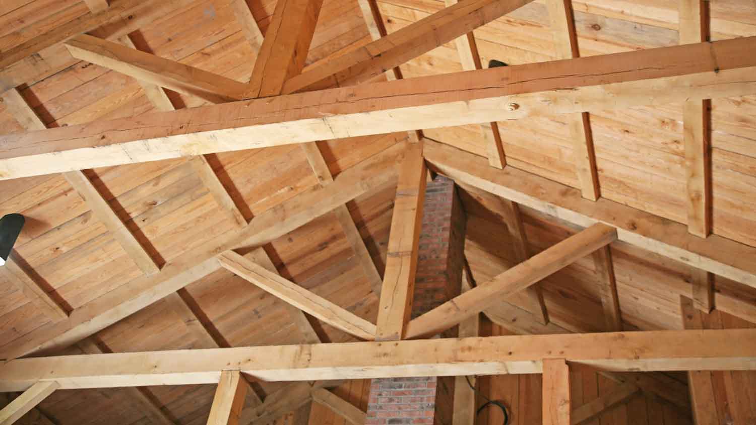 Structure of a wooden ceiling showing beams and joists