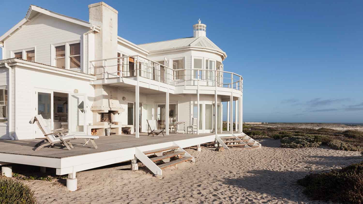 White beach house overlooking the ocean
