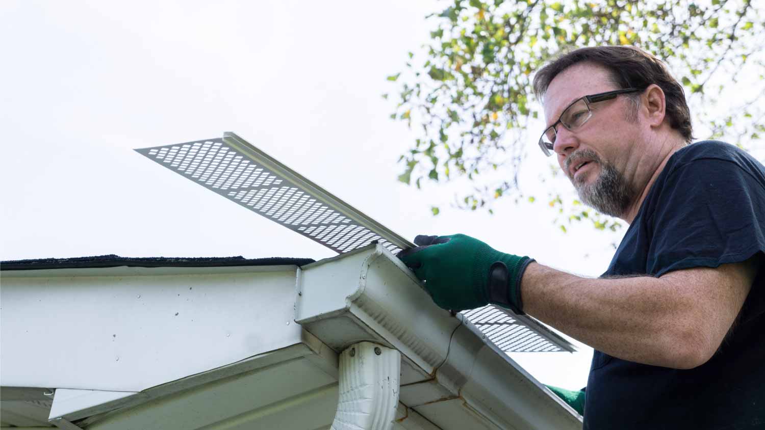 Man installing gutter guards