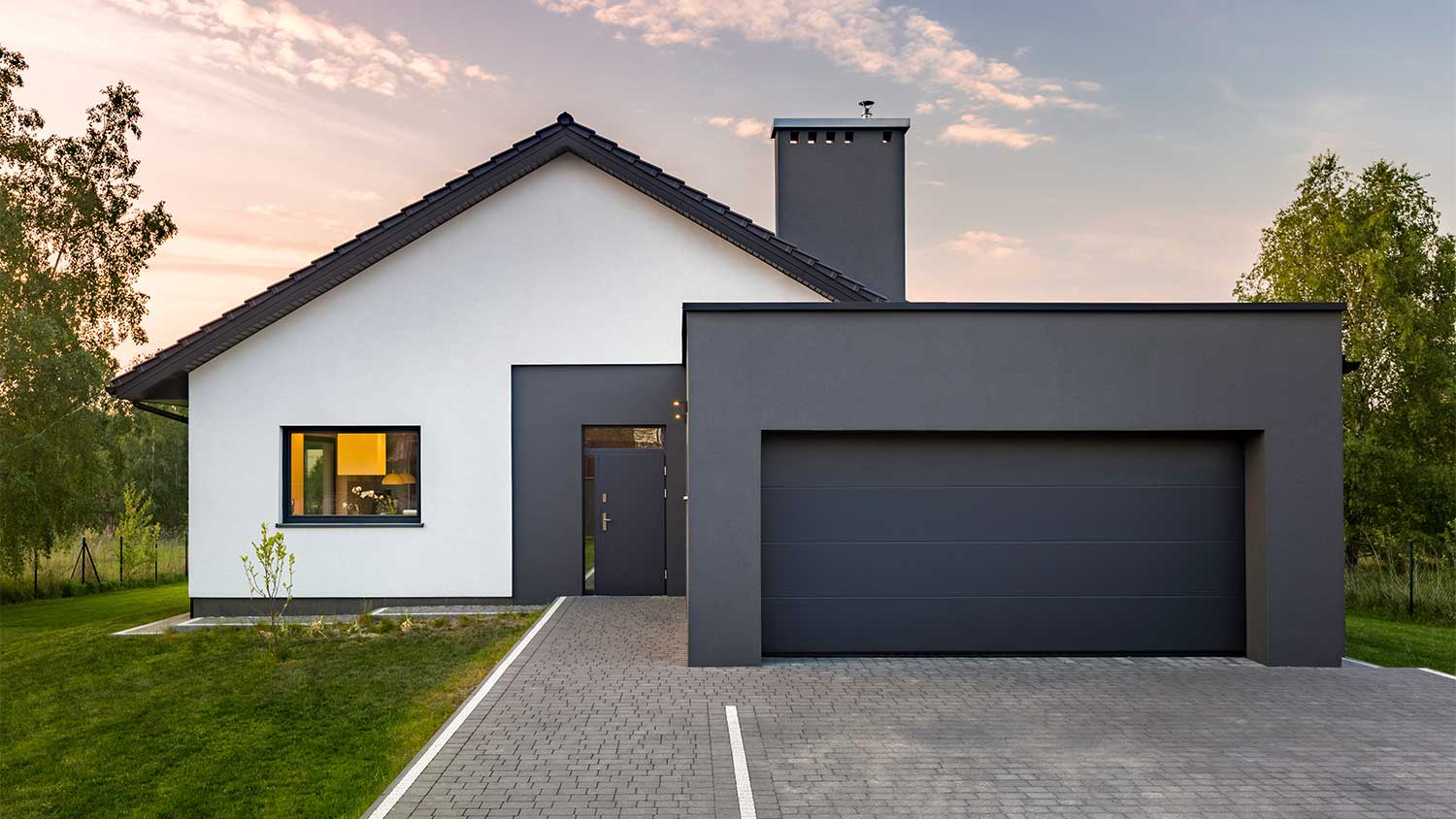 An exterior view of a black and white house
