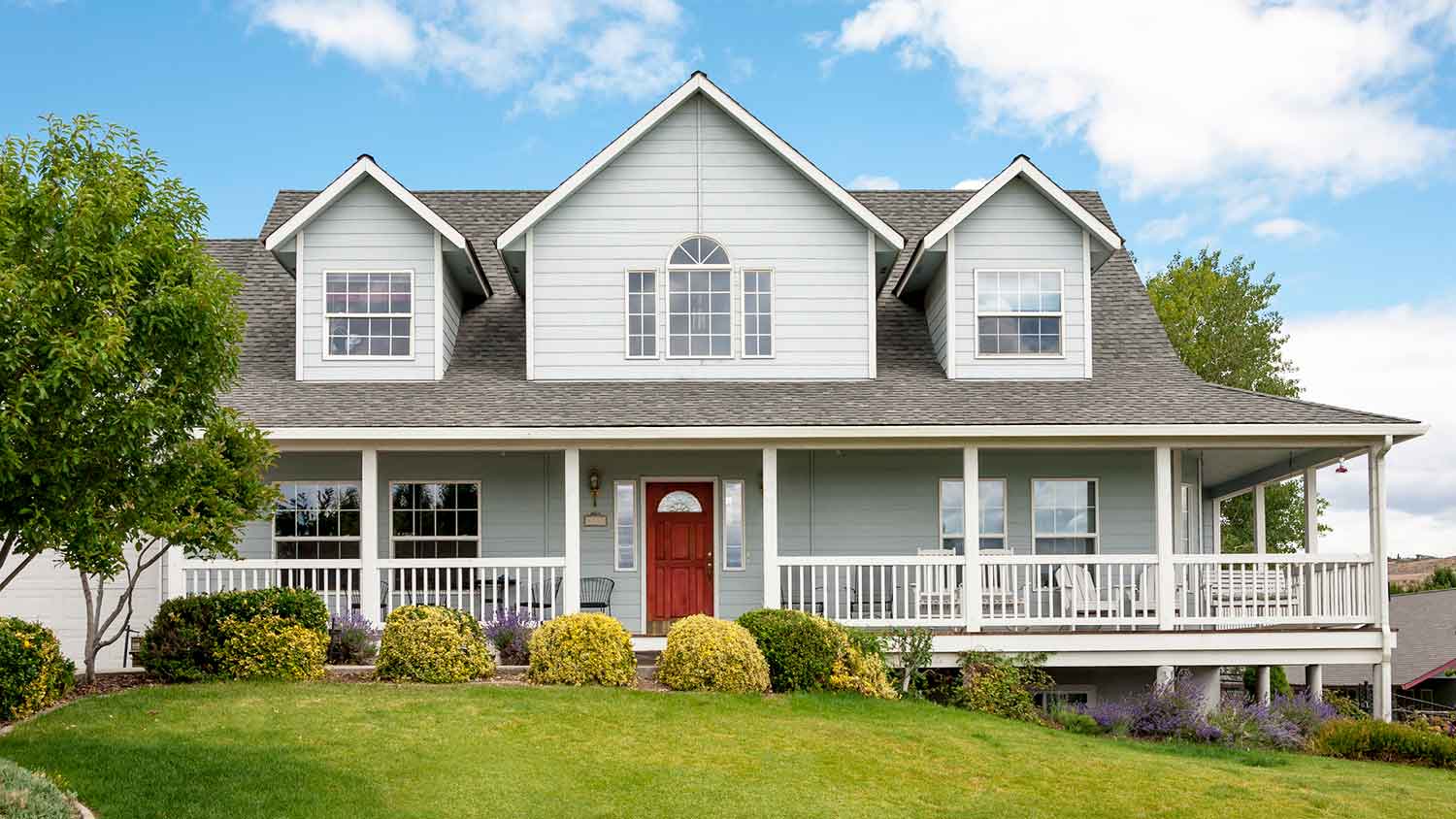 House exterior with dormer windows and porch