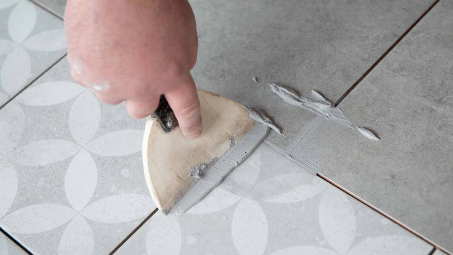 Man laying the ceramic tile