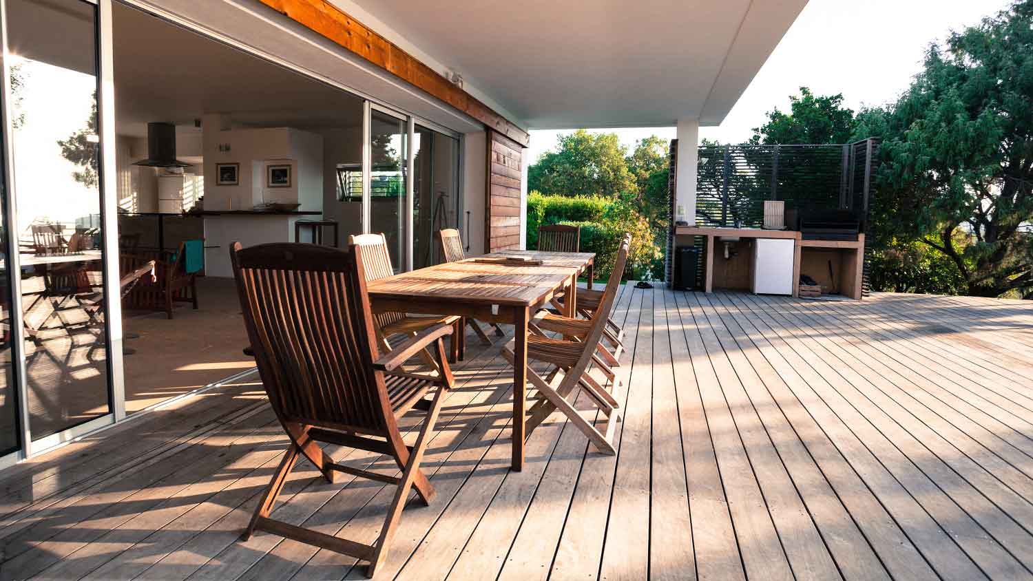 Modern outdoor kitchen on wooden deck