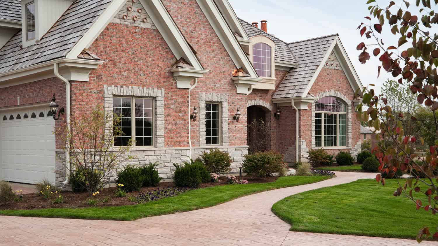 A big house with a brick veneer siding