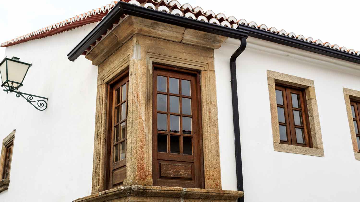 old white house with corner window