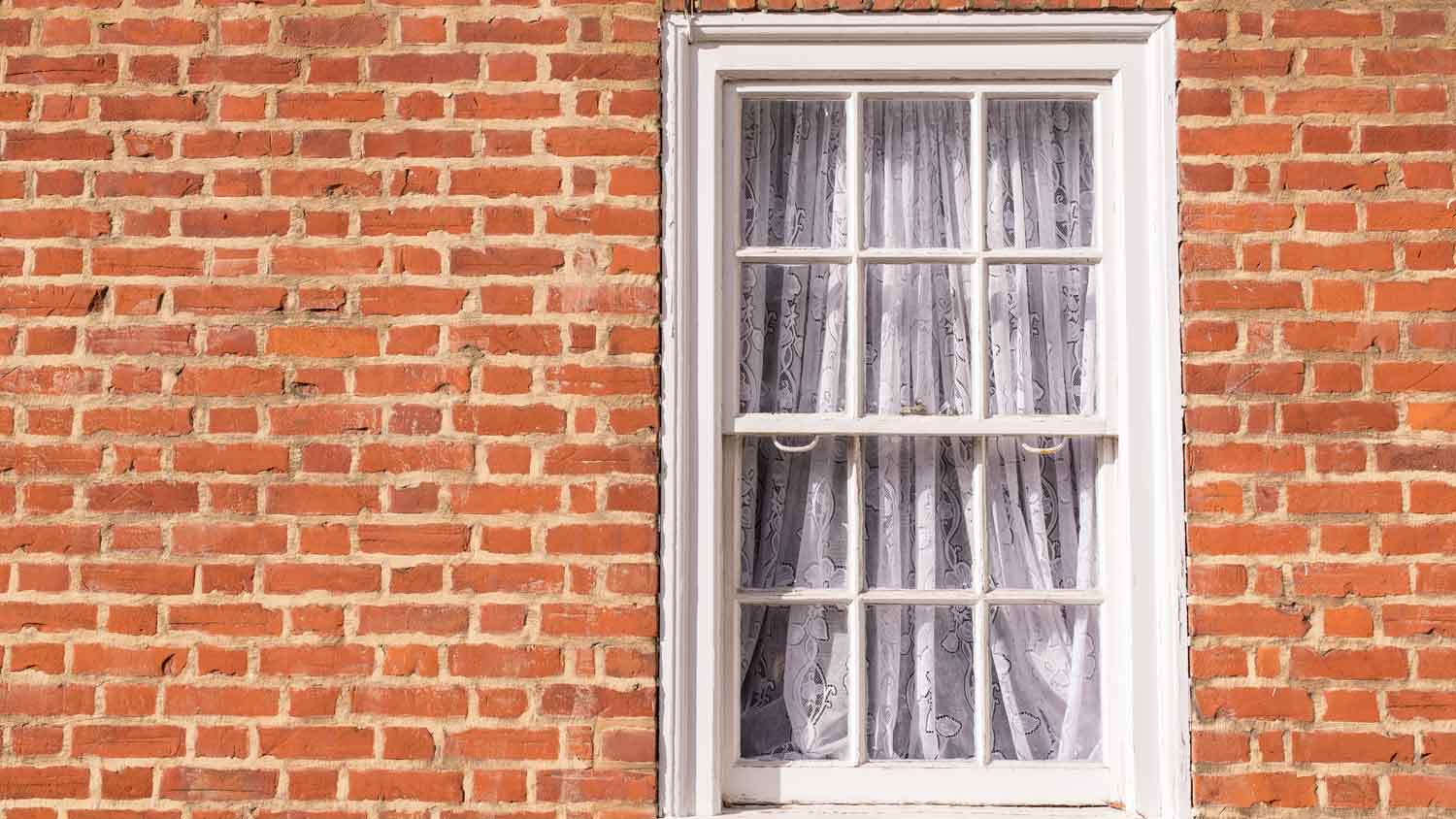 brick home with old sash windows