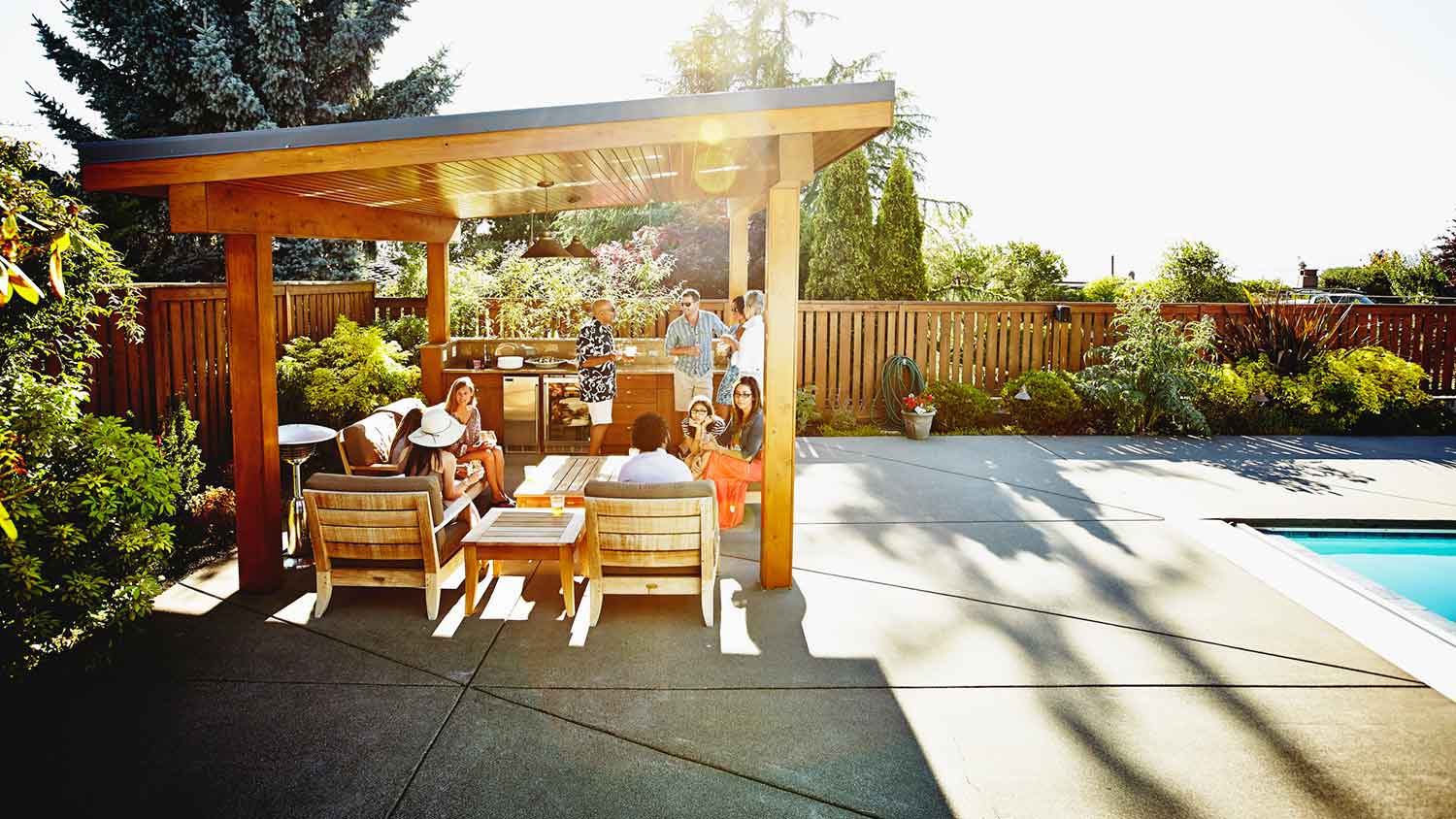 Group of friends enjoying time together under the gazebo