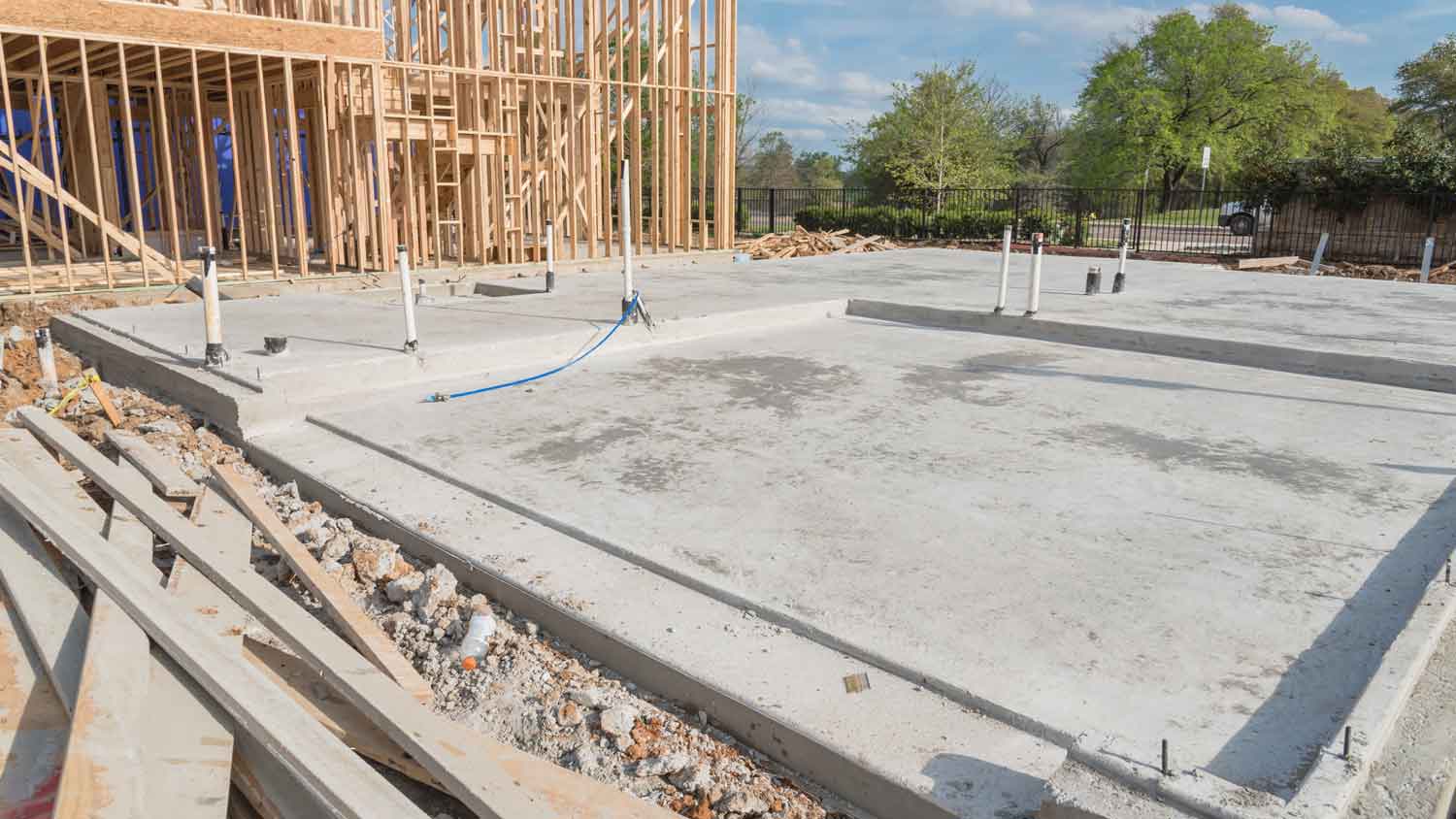 A slab-on-grade foundation in front of another construction site