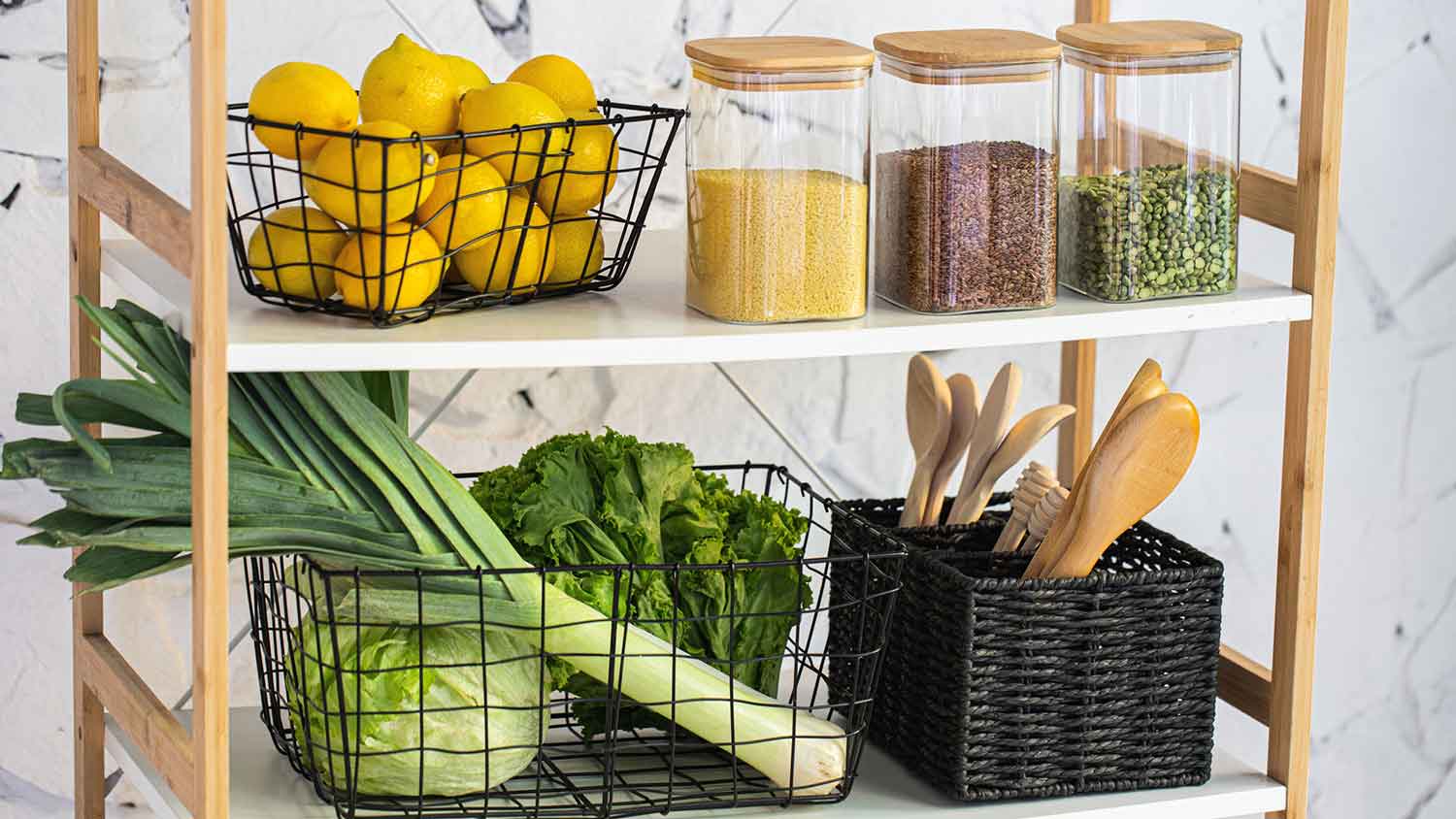 Wire baskets with lemons and vegetables