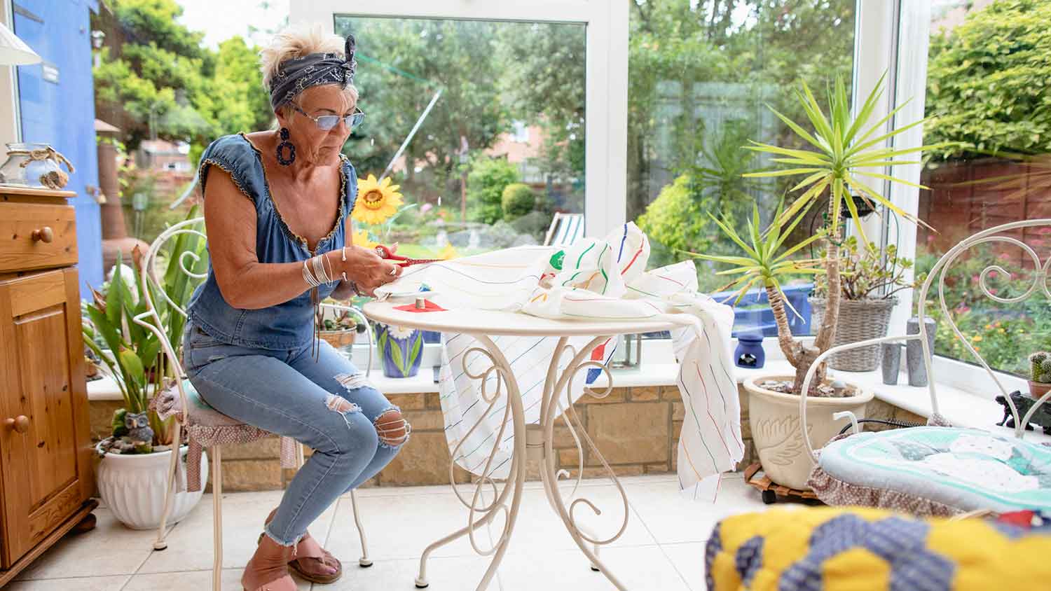 Woman crafting in the sunroom