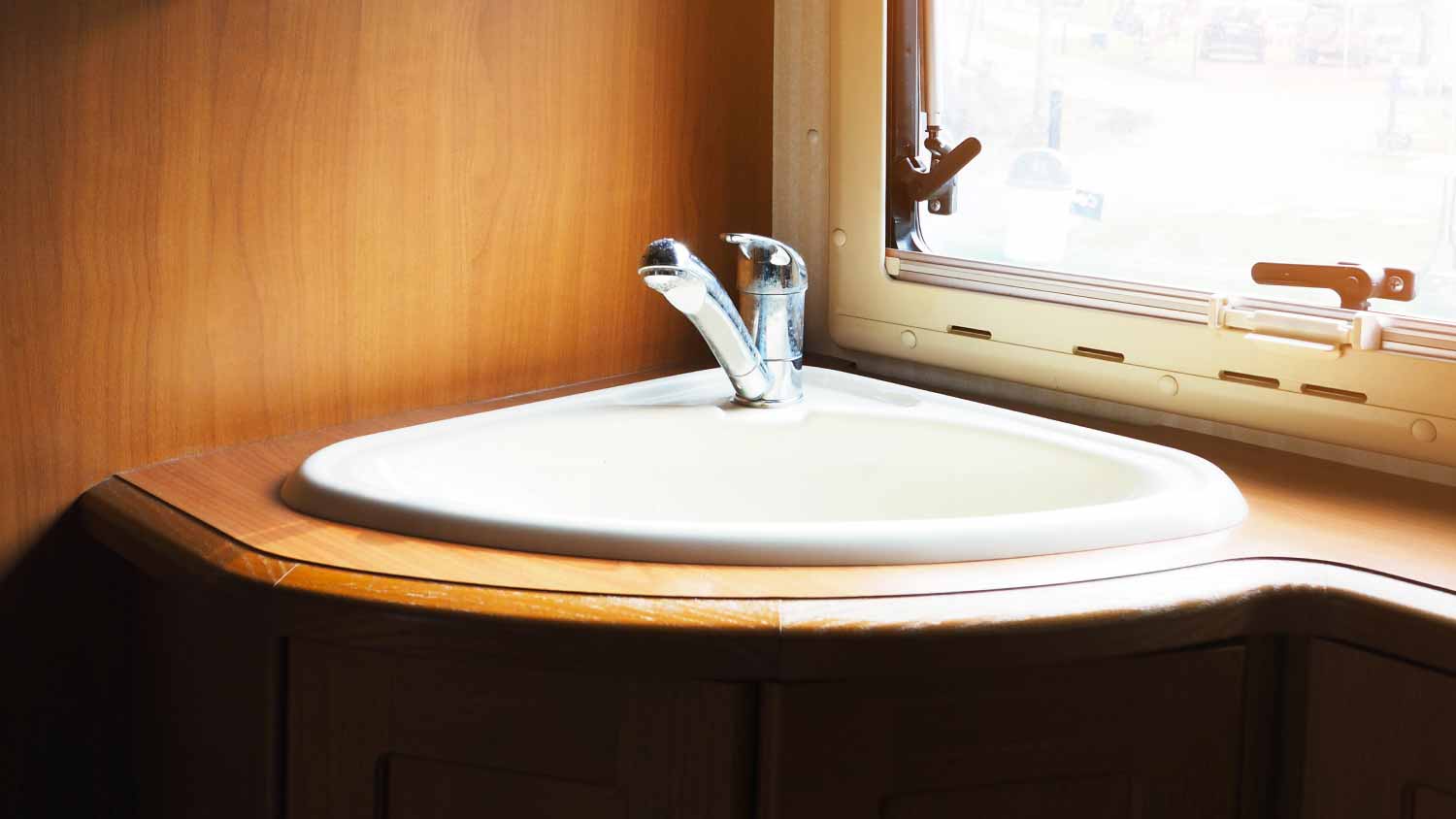 Hand wash basin in wooden bathroom