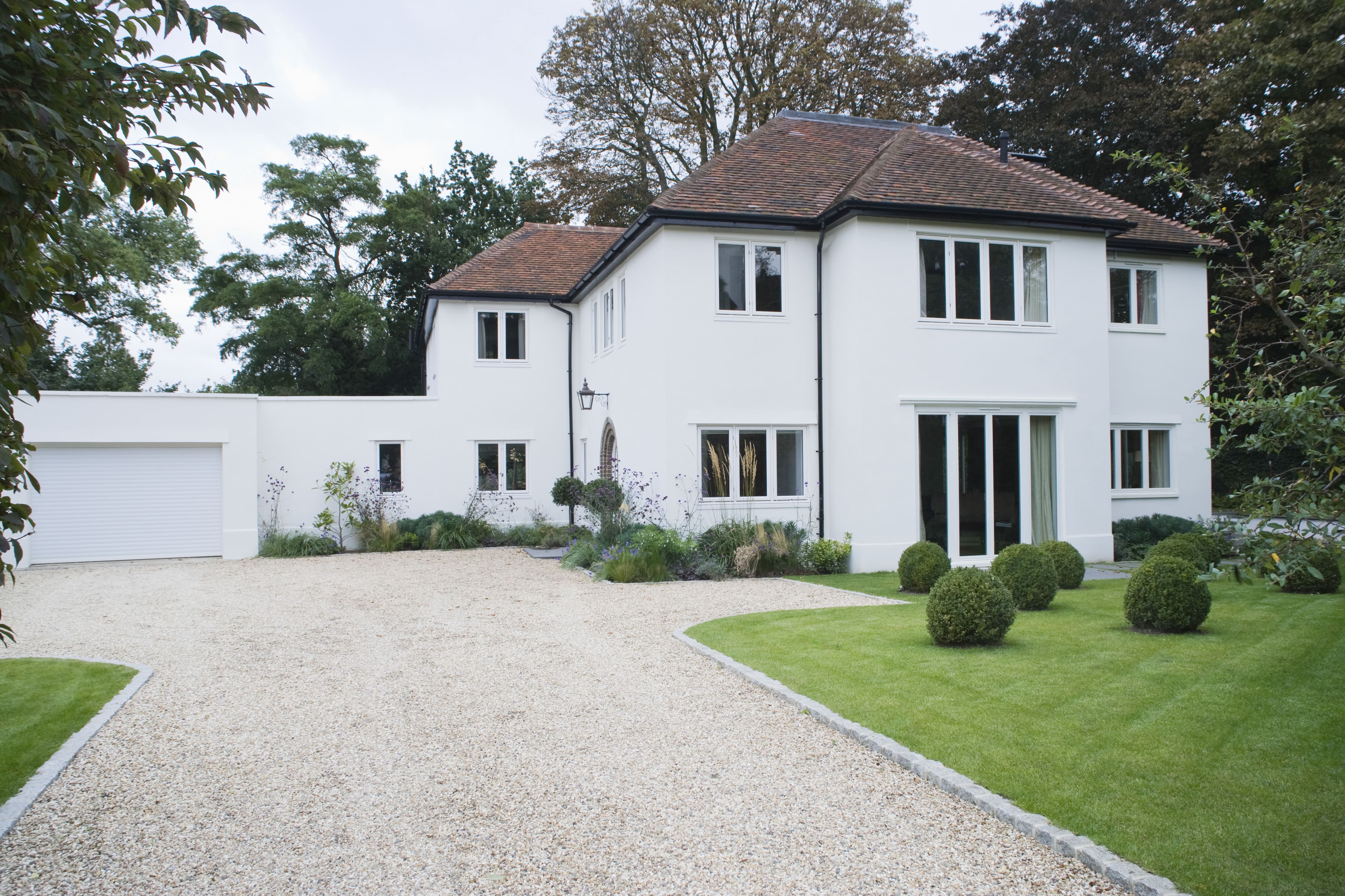 Y-shaped driveway in front of large home