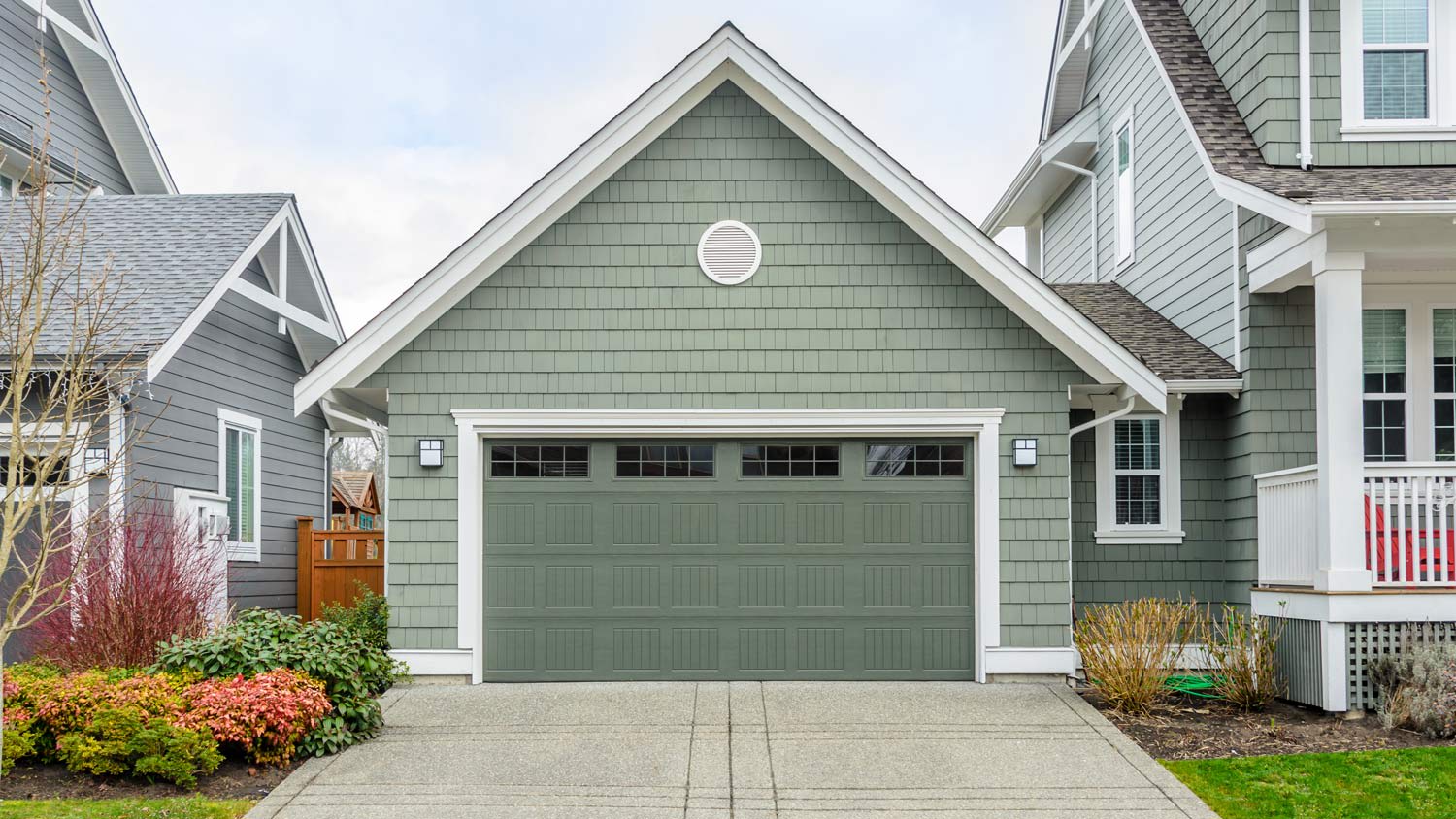 Green garage door attached to house