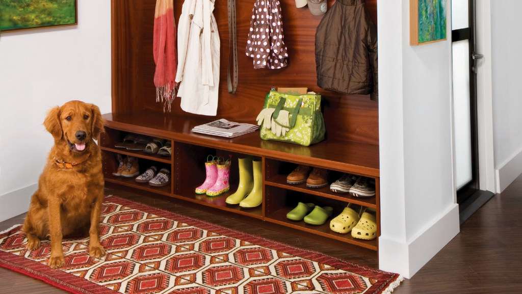 mudroom with rug and dog